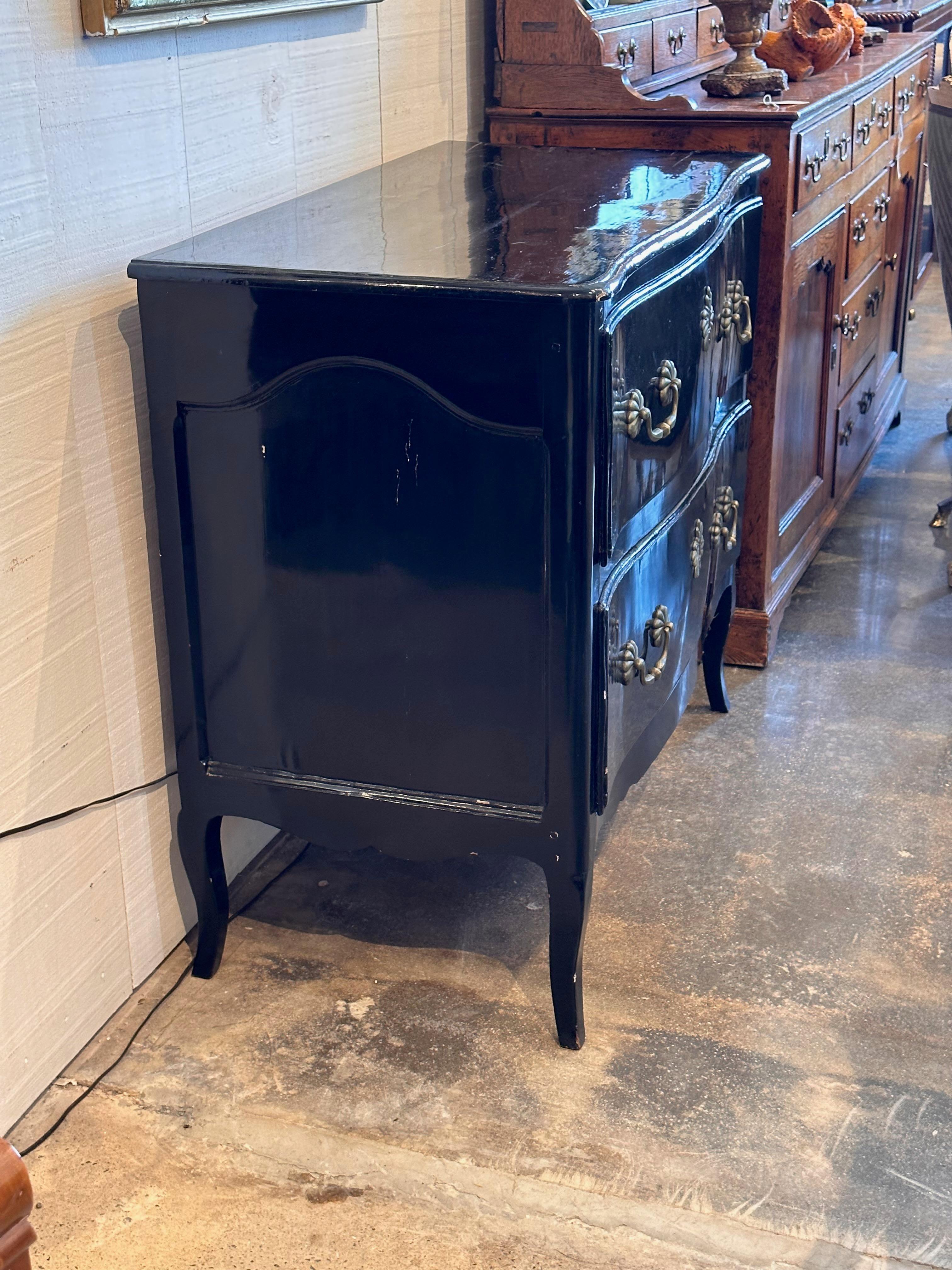In good shape. A black lacquered two drawer commode