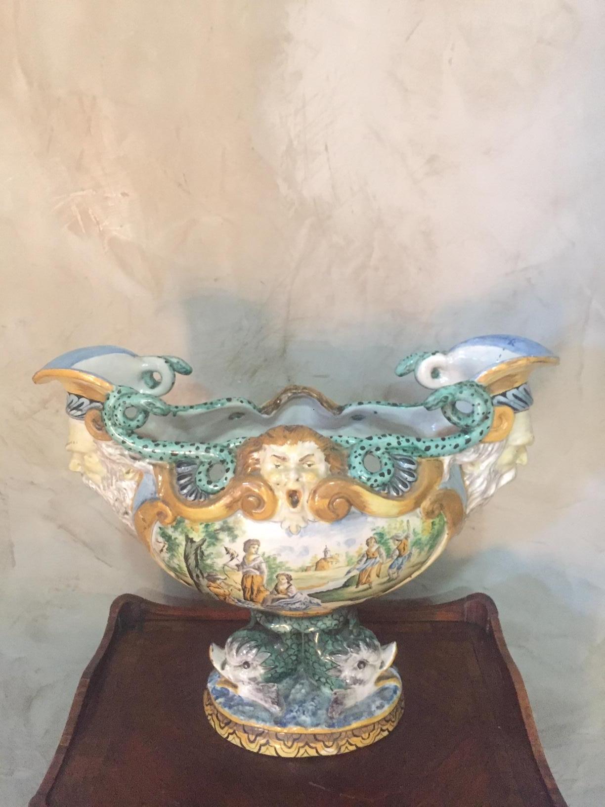 Original and rare late 18th century Italian Faience Jardiniere in very good condition. 
Painting landscapes, men's faces on the two extremities and green snakes. Ducks on the base. Very high quality and rare piece. Very nice details.