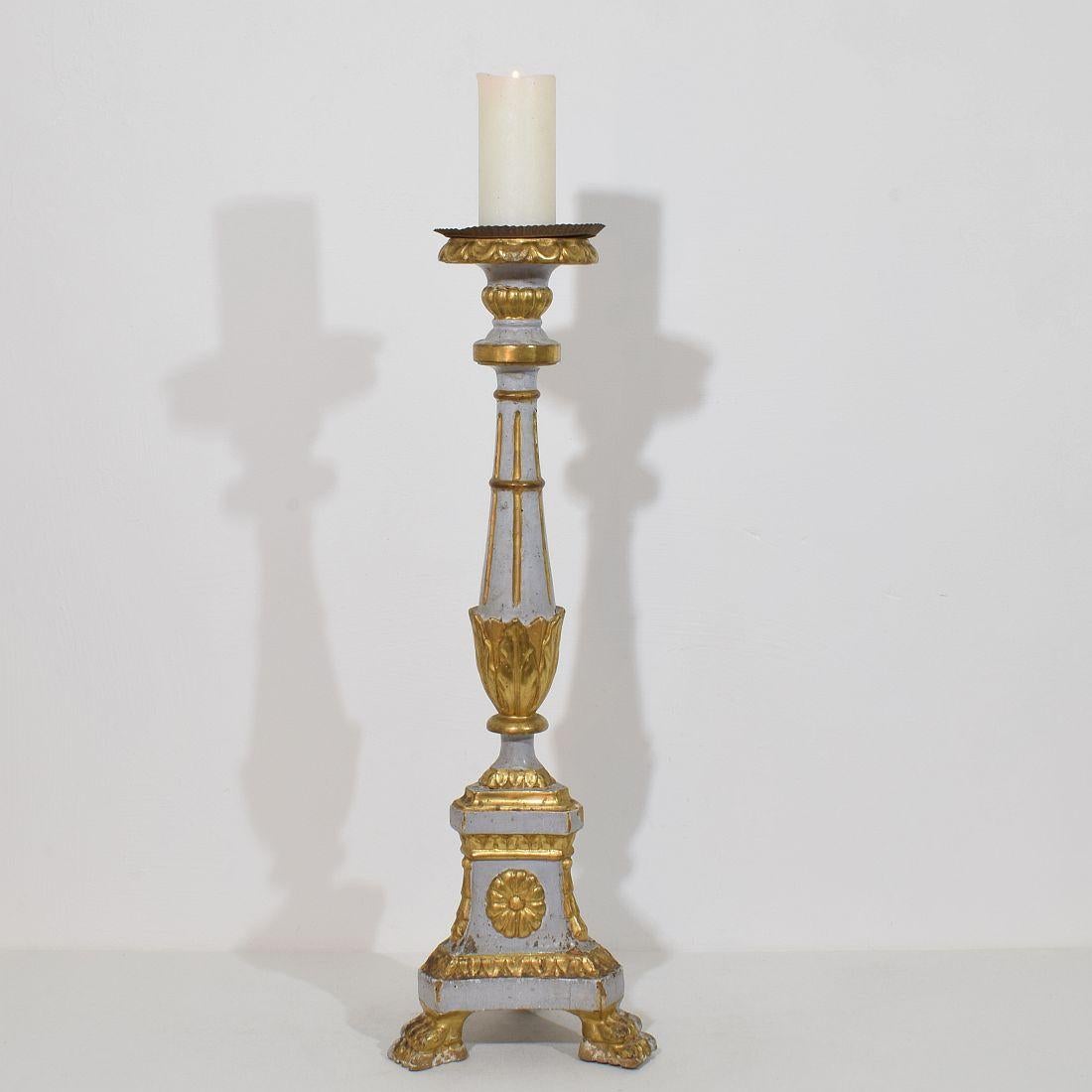  Great wooden candleholder with its original gilding.
Original period piece and rare to find.
Italy, circa 1780-1800.
Weathered and small losses.
Measurements include the metal peak
H:79cm  W:25cm D:24cm 