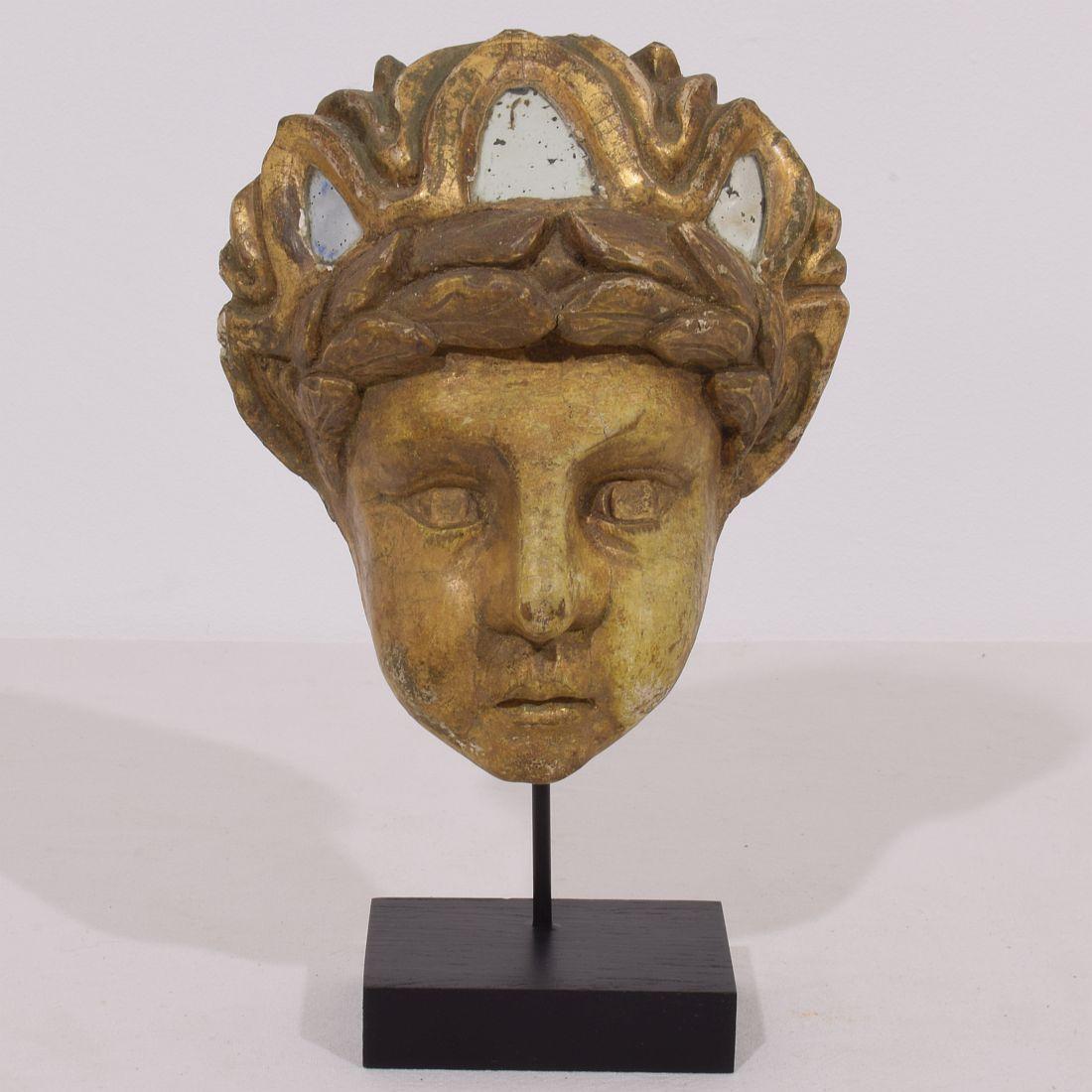 Beautiful 18th century neoclassical carved wooden head with small mirrors in a good but weathered condition.
Italy, circa 1780.
Measurements include the wooden base.