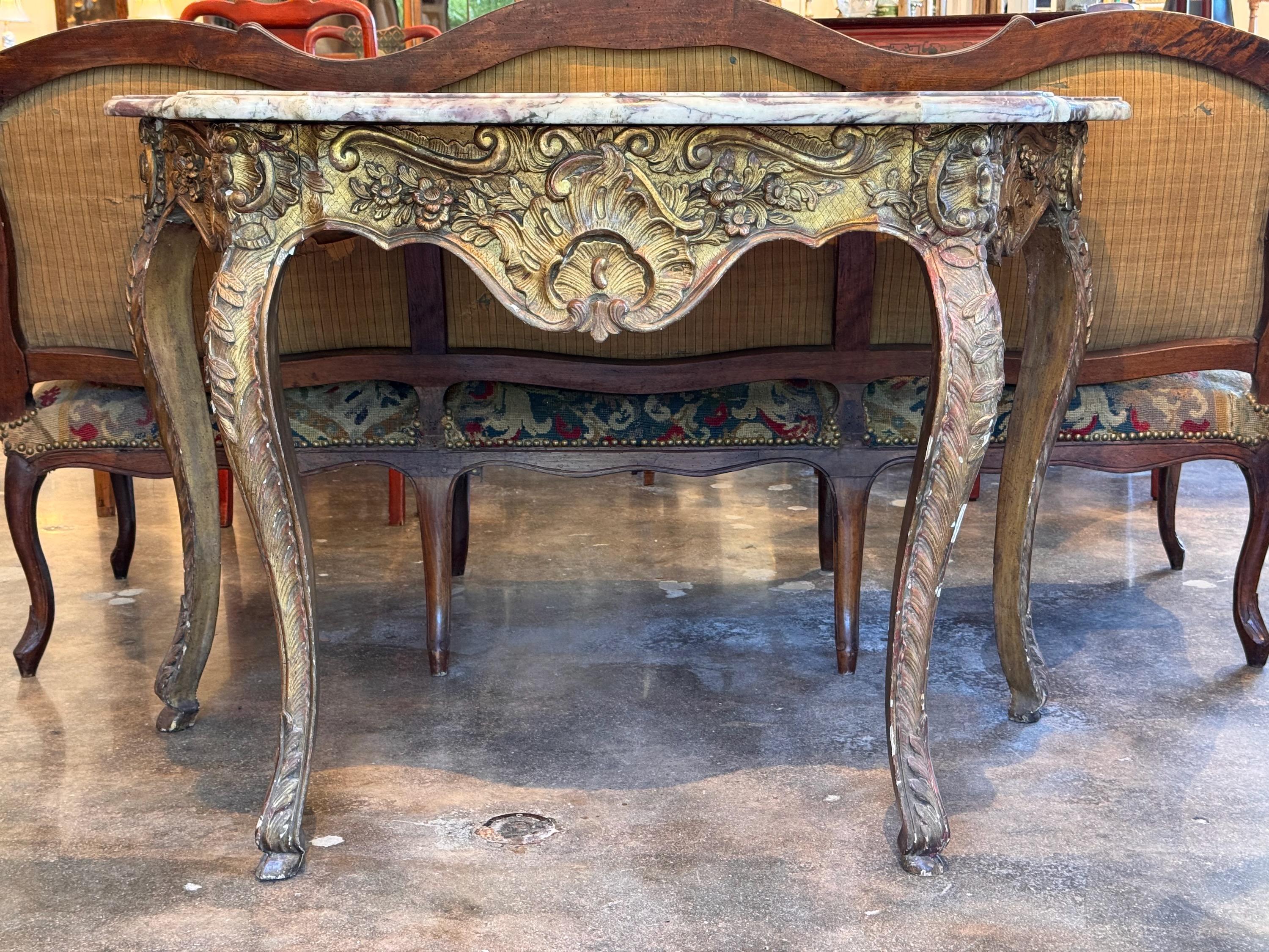 A beautiful Giltwood and marble console. All original . Great carvings