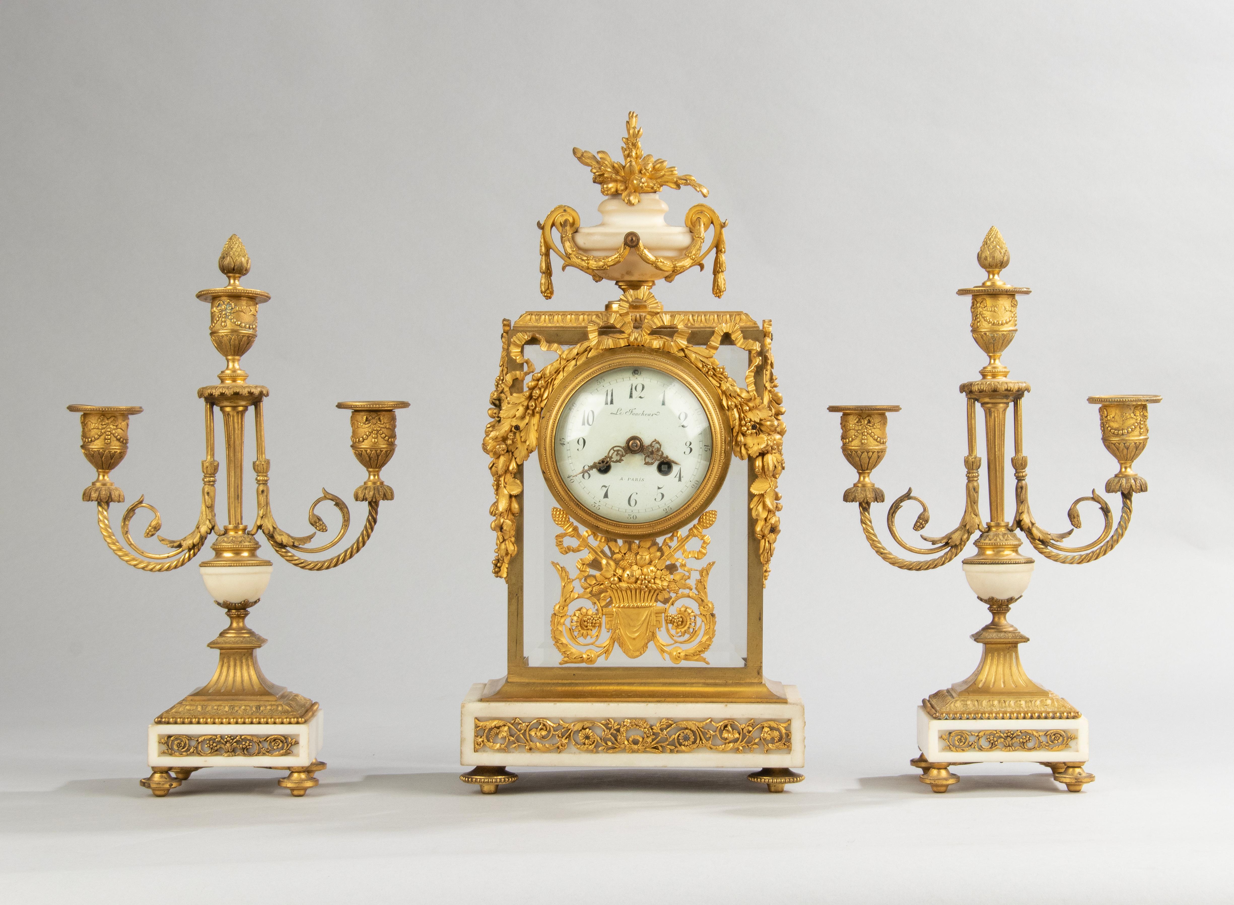 French Late 18th Century Louis XVI Period Bronze Ormolu Mantel Clock with Candelabras For Sale