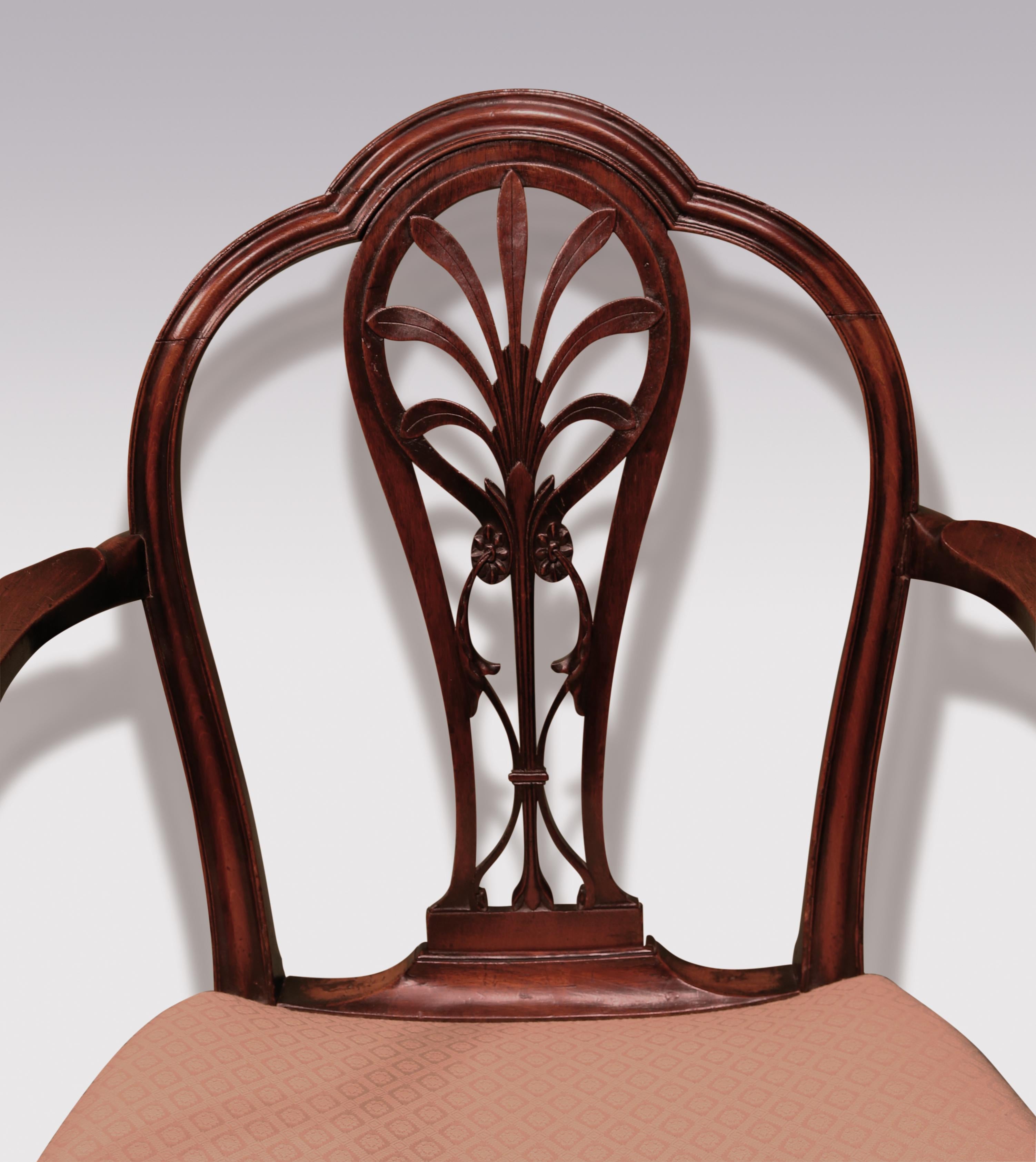 A late 18th century George III period mahogany armchair, having double arched back above central splat, finely carved with anthemion paterae & acanthus. The chair having well-shaped & moulded set-back arms with serpentine saddled seat, supported on