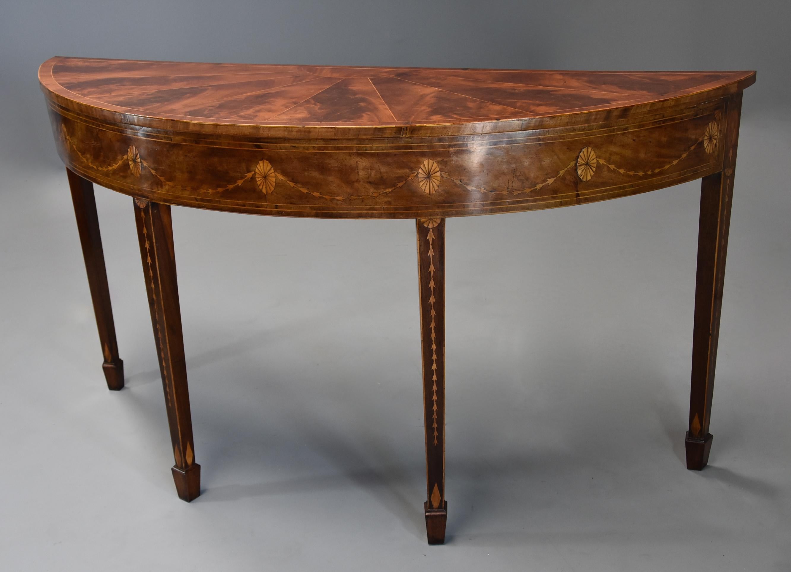 A rare late 18th century (circa 1780) mahogany side table of semi-elliptical form with superb, rich patina (color) of wonderful proportions, possibly Irish.

This table consists of a semi-elliptical top with a design of segmented curl mahogany