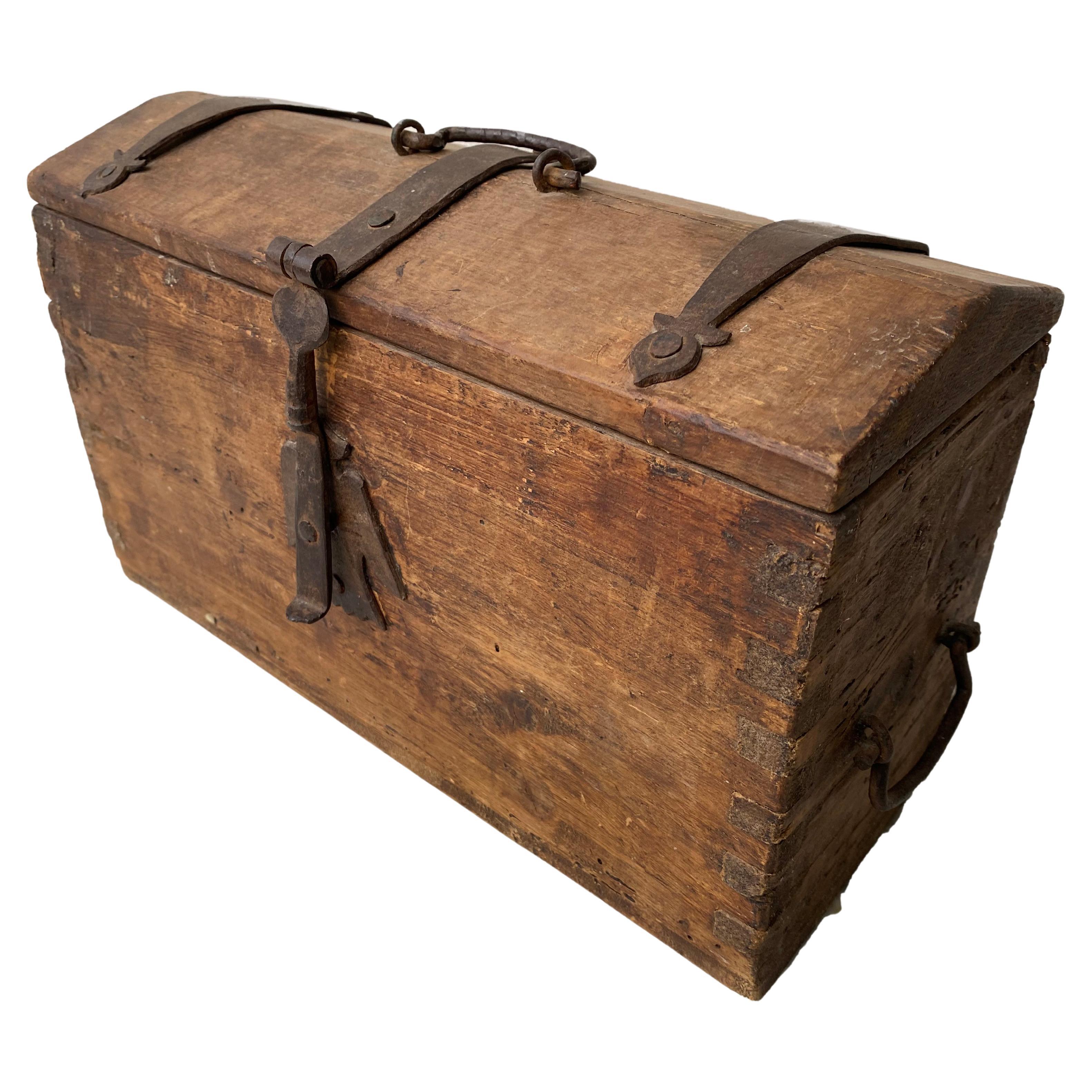 A rare miniature trunk from late 18th century, crafted in solid wood and adorned with a hand-carved double-headed eagle motif. Pieces of this size and detail are seldom found, especially with such well-preserved patina and original character. 

A