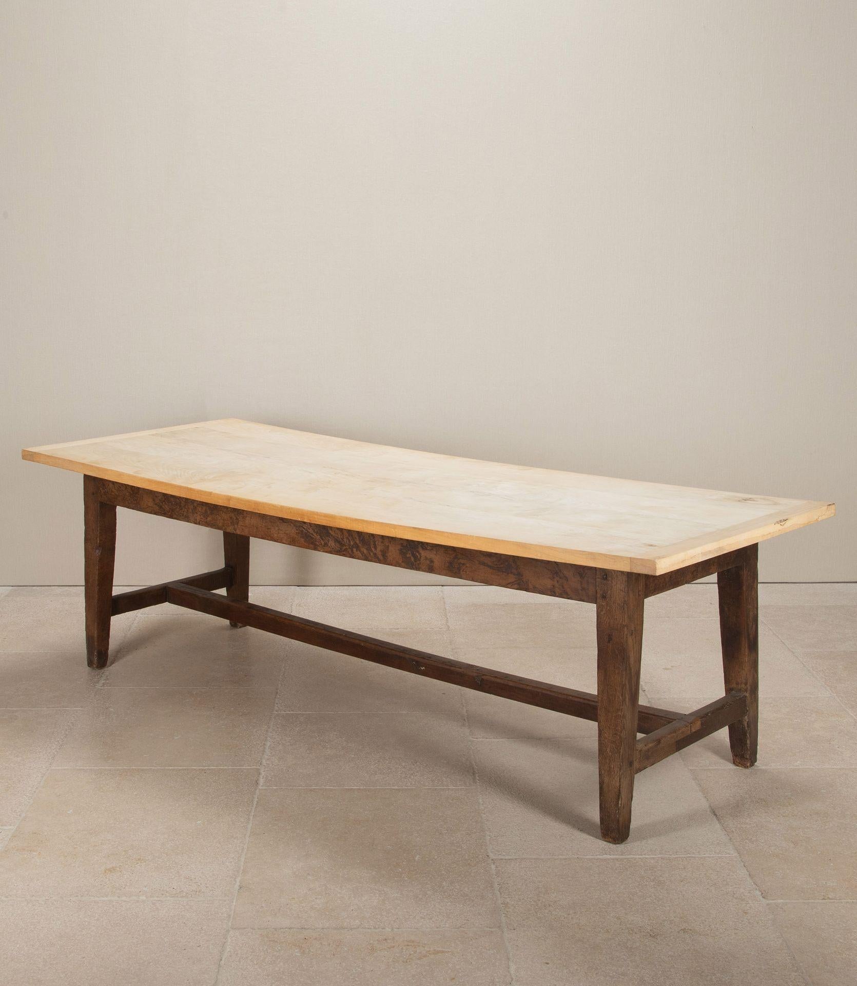 A wonderful and large scale, late 18th Century English Country House oak dining table. With rare burr oak side stretchers, oak legs and base stretchers, the later sycamore top is a beautiful mellow cream colour. Would work perfectly as either a