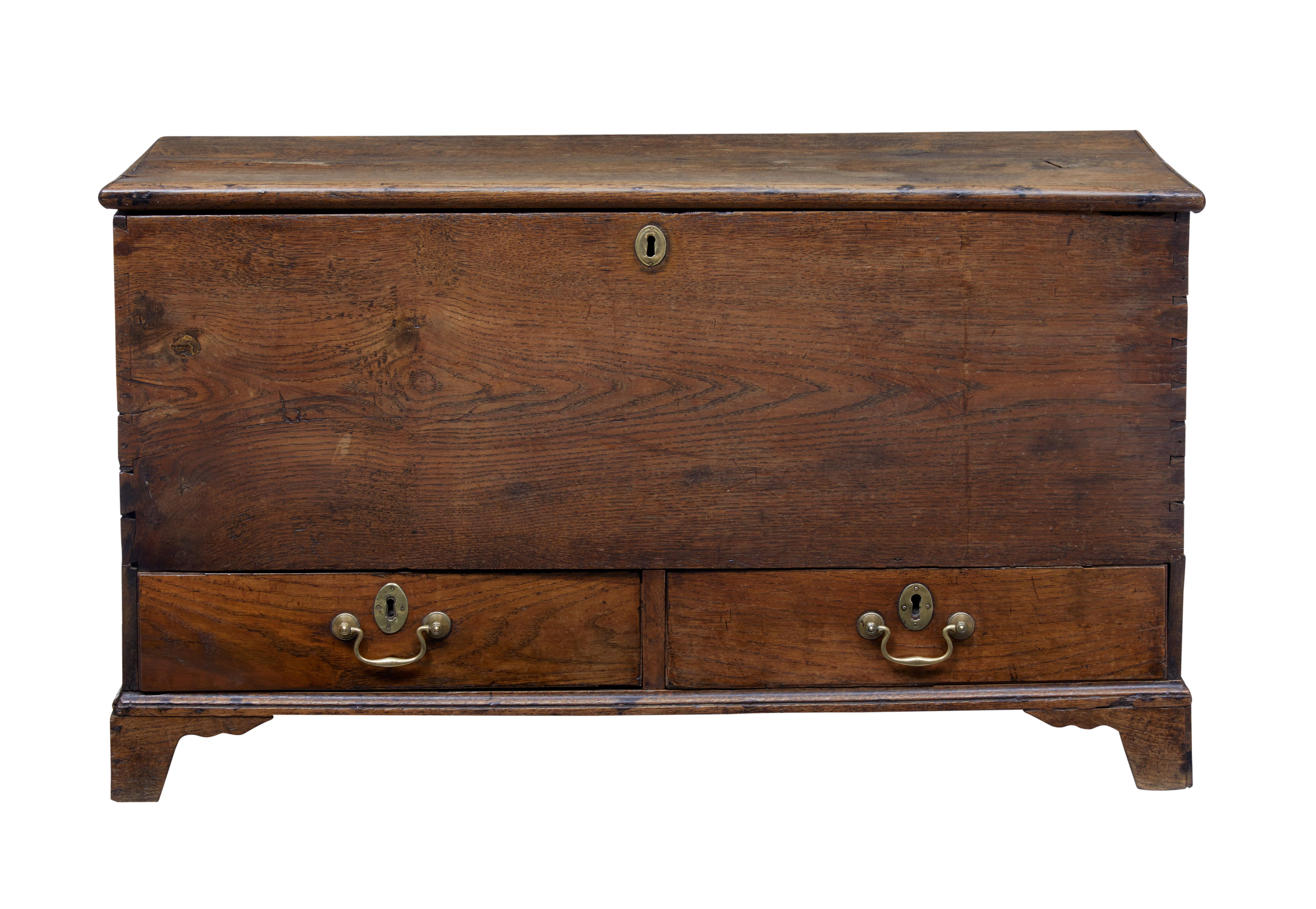 Here we have a late Georgian oak mule chest of small proportions, circa 1790.

Top lid opens for storage space, with a pair of drawers with brass swan neck handles below.

Good color and patina, standing on bracket feet.

Expected minor age