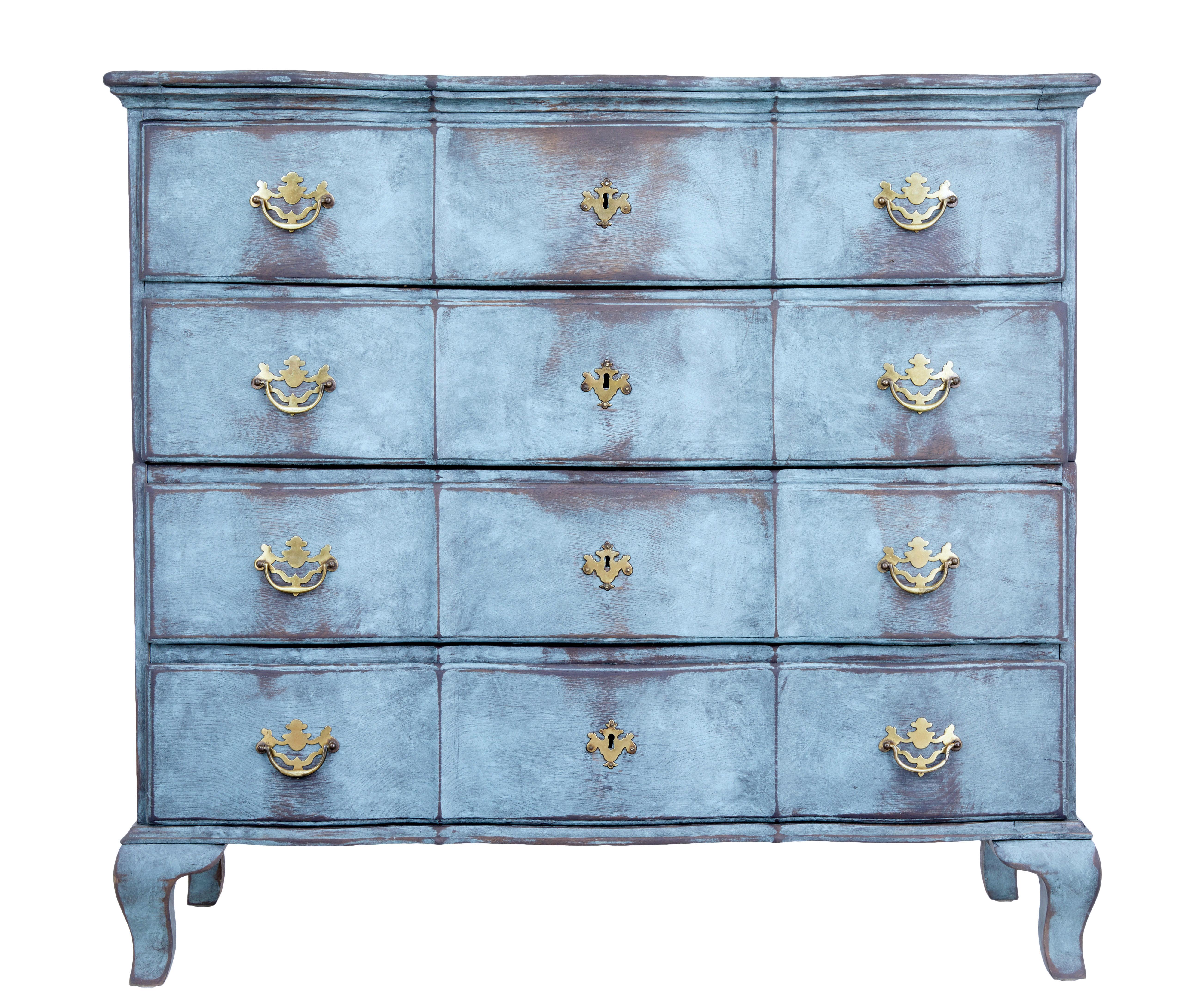 Danish painted chest of drawers of large proportions, circa 1790.

4 shaped drawers with ornate brass handles and key plates. Due to the size of the chest when made it was designed in 2 sections so it could be installed into smaller