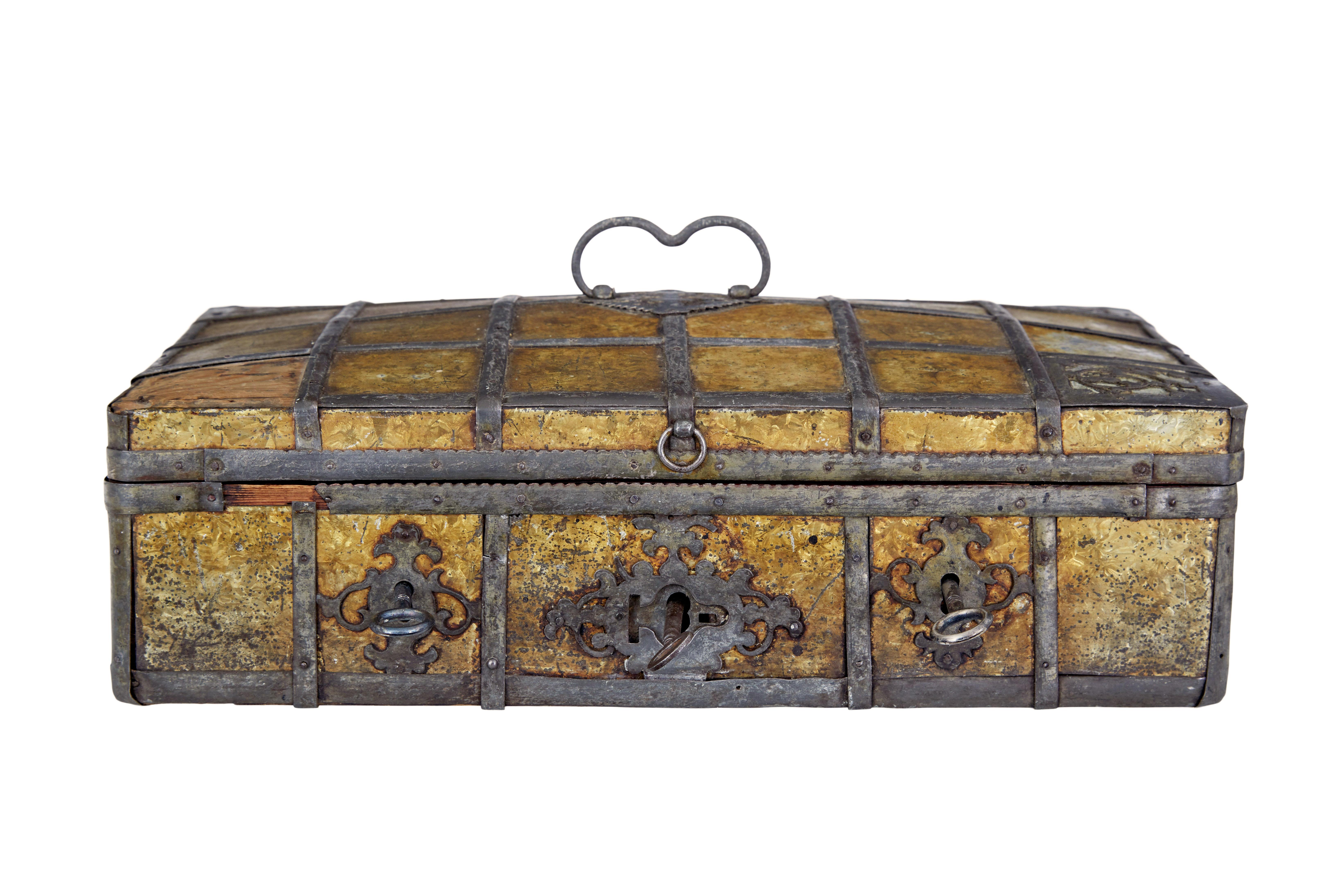 Late 18th century scandinavian metal bound box circa 1790.

Rare baroque inspired strong box with 3 locks on the front.  Quite likely to have been a box of some importance during it's early life, being fitted with 3 locks which would have meant