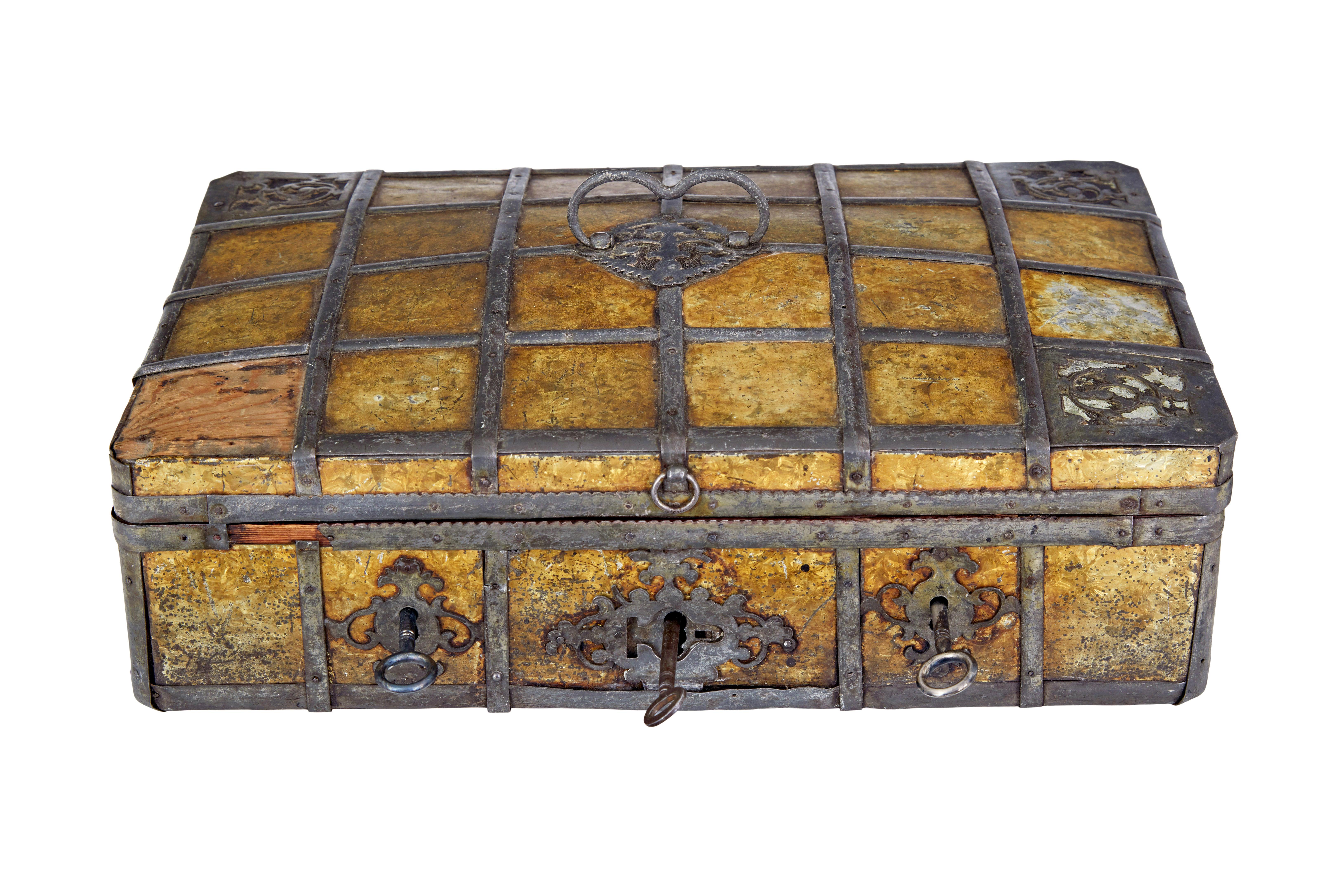 Late 18th century Scandinavian metal bound box circa 1790.

Rare baroque inspired strong box with 3 locks on the front.  Quite likely to have been a box of some importance during it's early life, being fitted with 3 locks which would have meant that