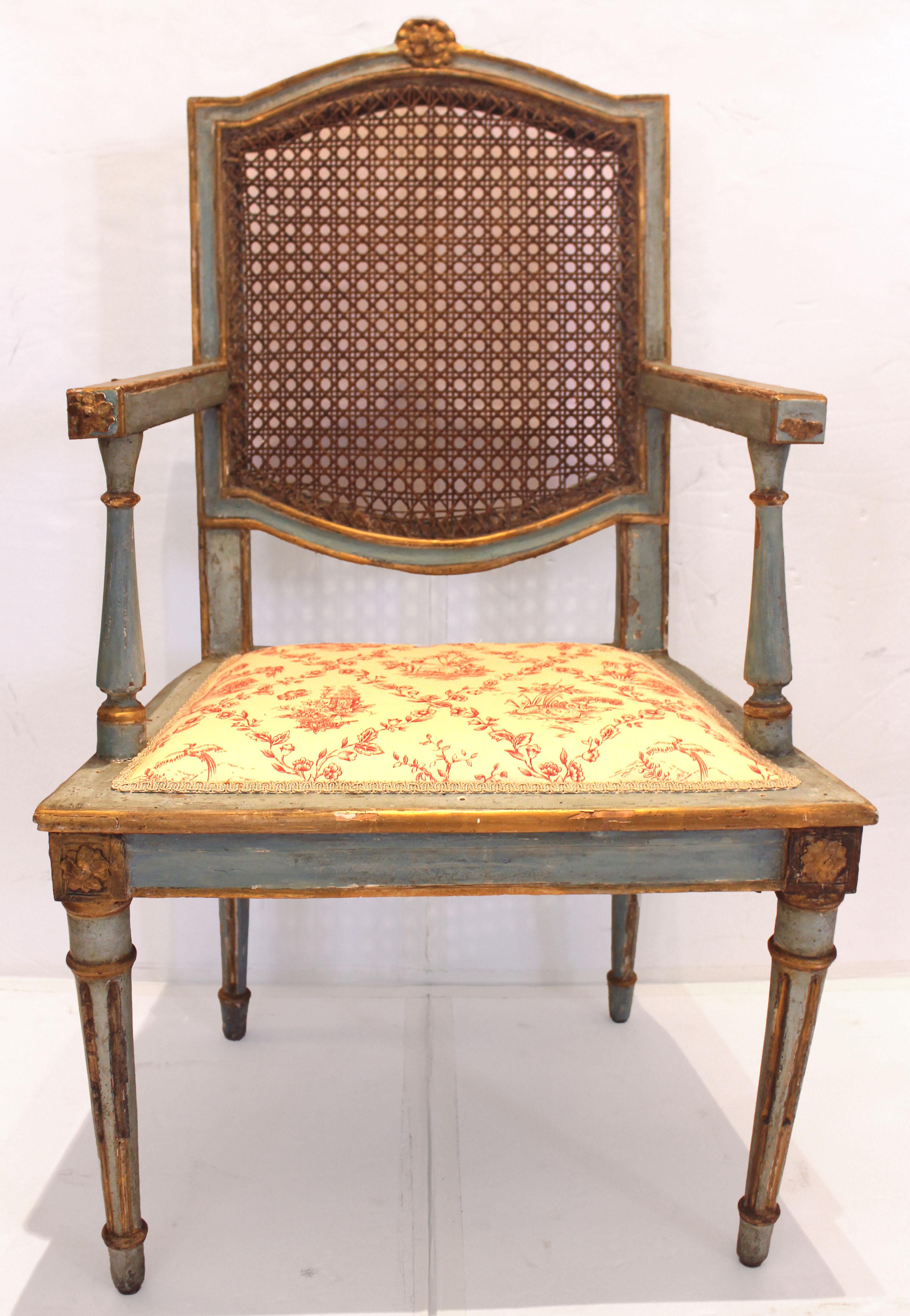 Late 18th century set of 6 painted & parcel gilt arm chairs, Italian. Neo-classical period & taste. Small beaded florets break the arch of the crest rails, the florets repeated at each front & side of the front legs & arm tip. Raised on turned,