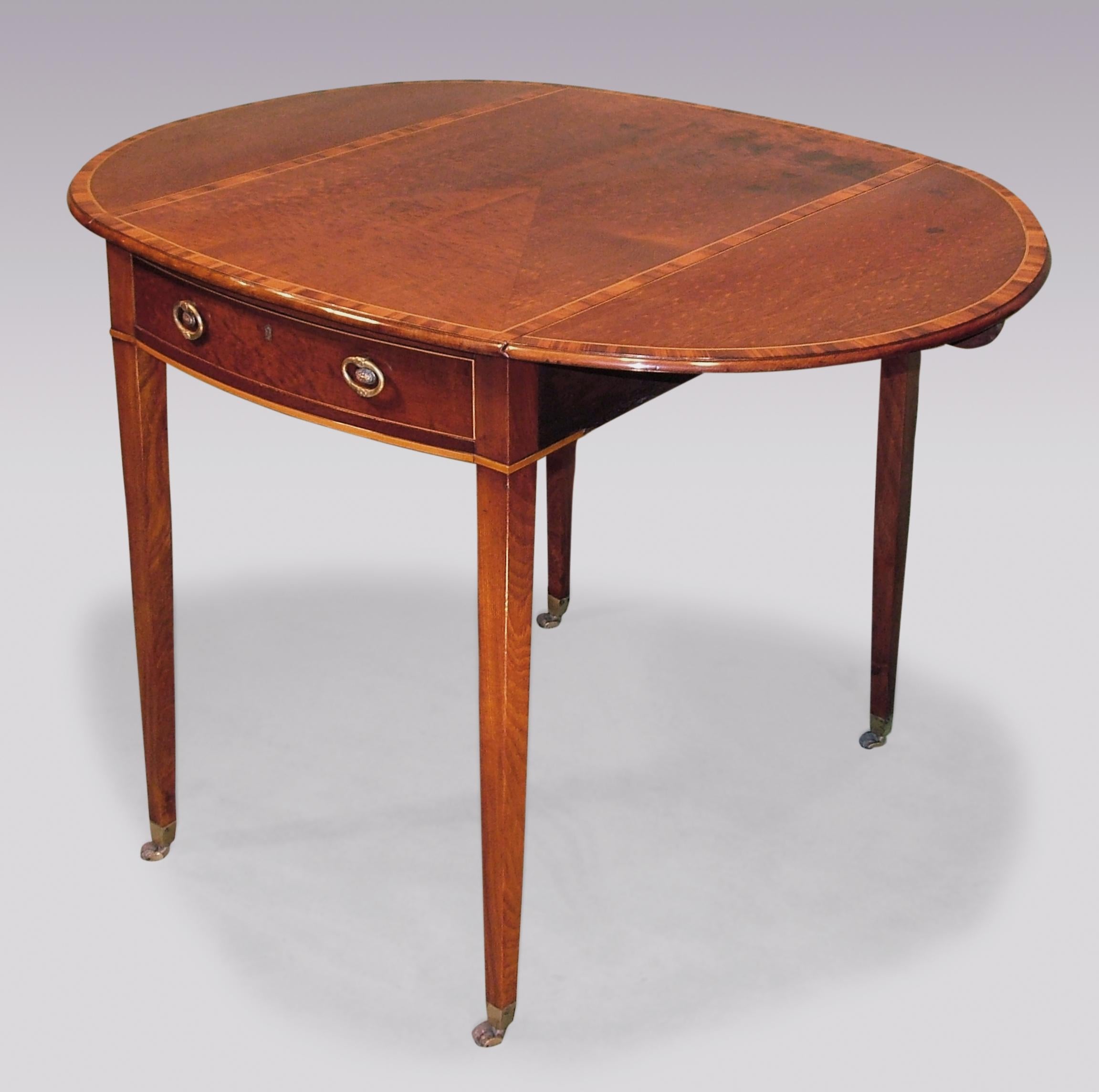 A late 18th century Sheraton period fiddle back mahogany Pembroke table having padouk wood, box wood and ebony banded oval top with mitred center above frieze drawer retaining original handles supported on square tapering legs ending on original