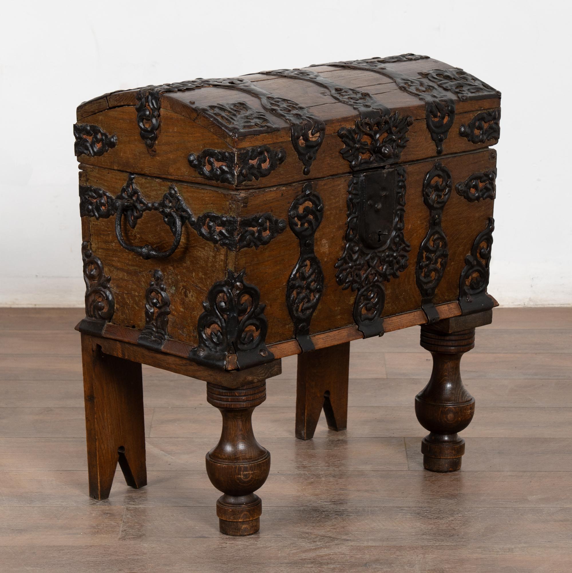 It is the incredible hand-wrought iron details that make this small dome top trunk an exceptional find. The elaborate iron work indicates this likely served as a lock box or private safe at the time it was commissioned.
The age of this trunk is