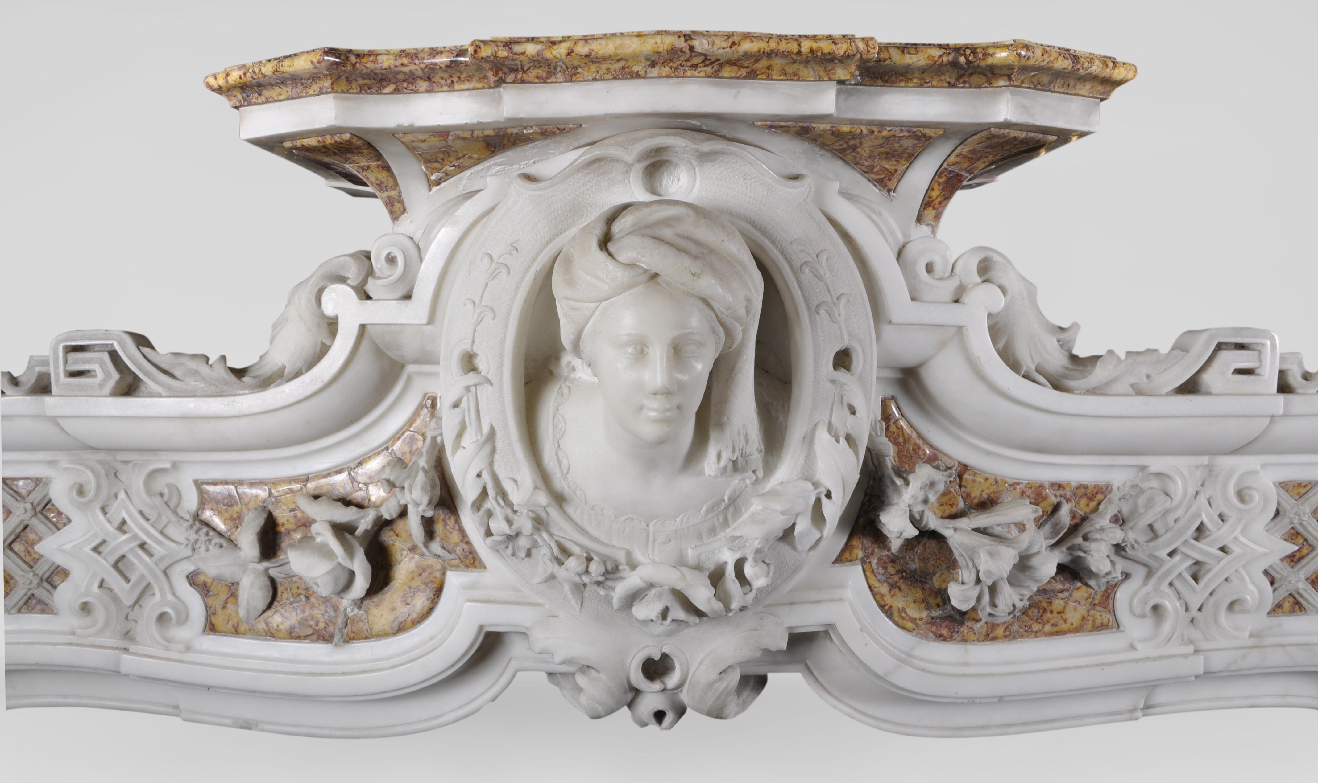 This exceptionnal baroque fireplace is from Italy, dated as the end of the 18th century. It is an outstanding marble piece, and gathers two types of beautiful and distinct marbles; white statuary Carrara marble and Brocatelle marble, characterized
