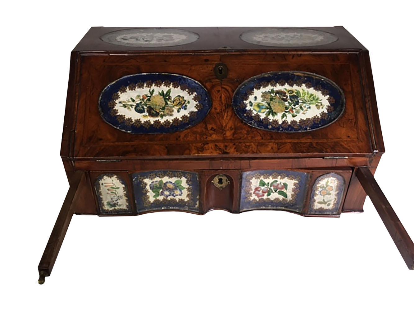 Rare English table top fall front writing desk in burl walnut and blue eglomise painted oval panels. Ten panels inside painted with flowers and fruit surrounded with blue trim. Inside fitted with drawers. Circa 1780-1820.