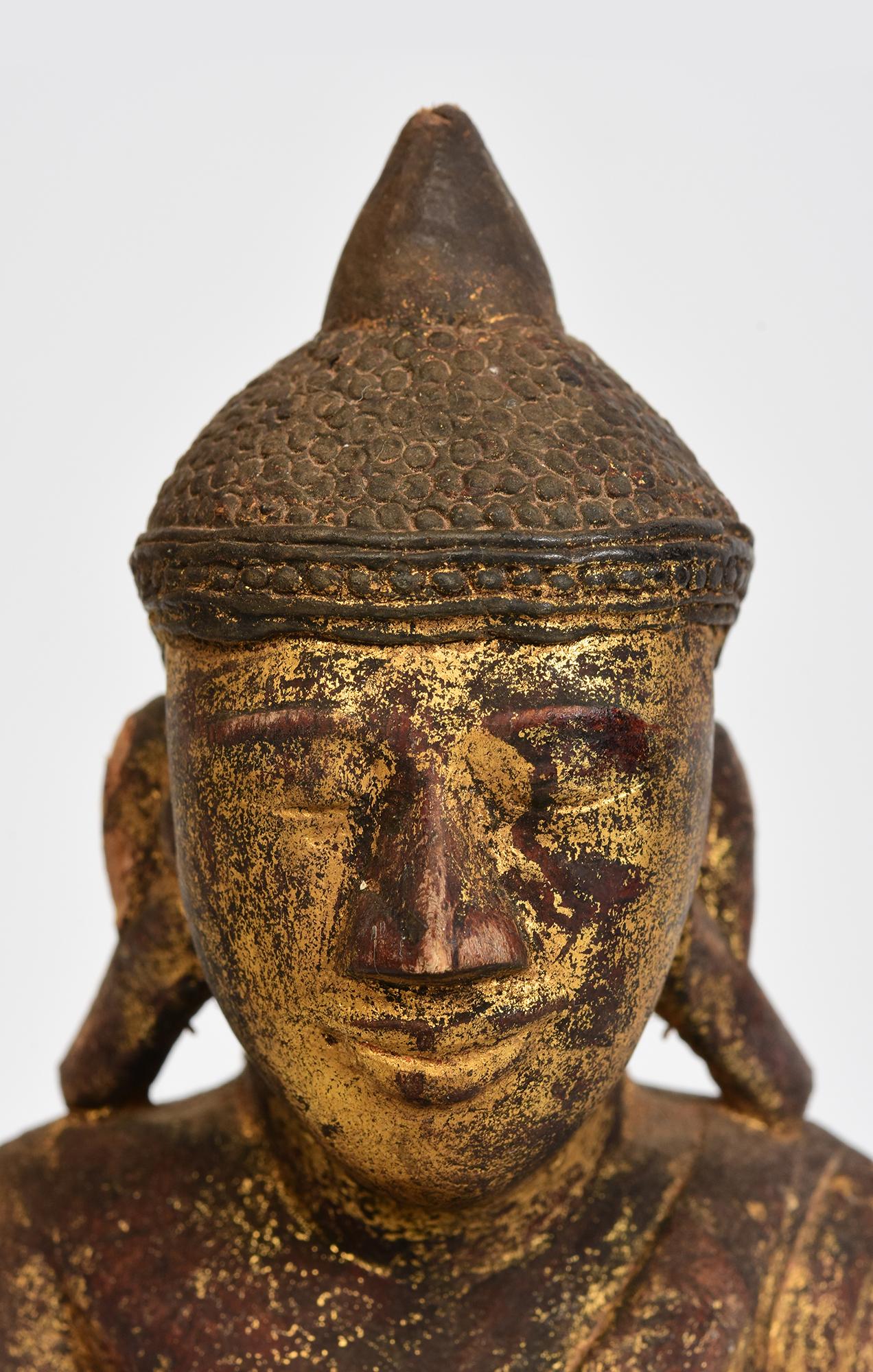 Antique Tai Yai Burmese wooden Buddha sitting in Mara Vijaya (calling the earth to witness) posture on a base.

Tai Yai is a group of tribal people living in Burma. It is difficult to find Buddha from this ethnic group.

Age: Burma, Late 18th