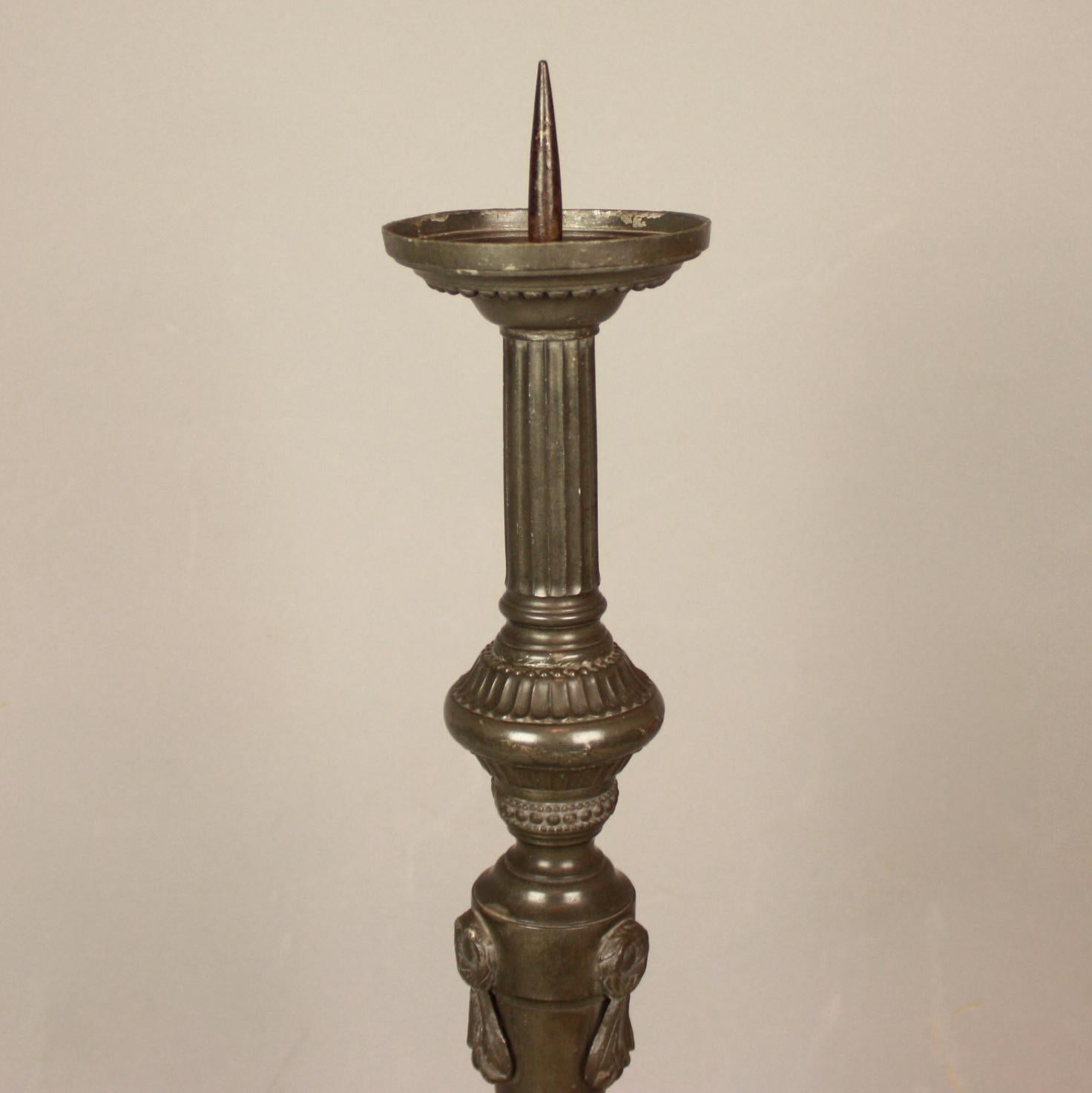 Late 18th Century French Louis XVI large Neoclassical Pewter Altar Candlestick

A late 18th century altar candlestick or orchere decorated with neoclassical motifs including beaded mouldings, wreaths and festoons. Supported on an triangular base,