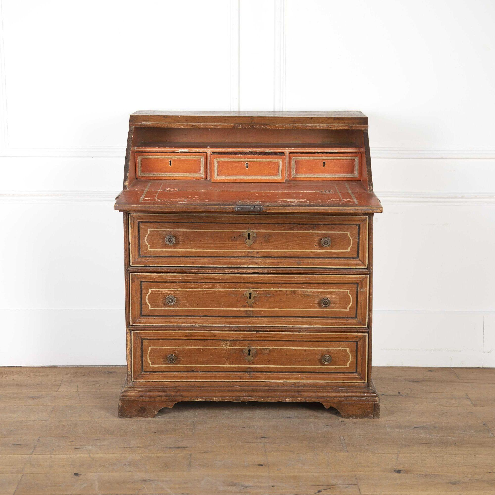 Late 18th century Tuscan bureau.
Dating from the late 18th Century, this Italian painted bureau originates from Tuscany.
The slope top is line inlaid with an inner line inlaid panel having shaped ends, the three long paper lined drawers below with