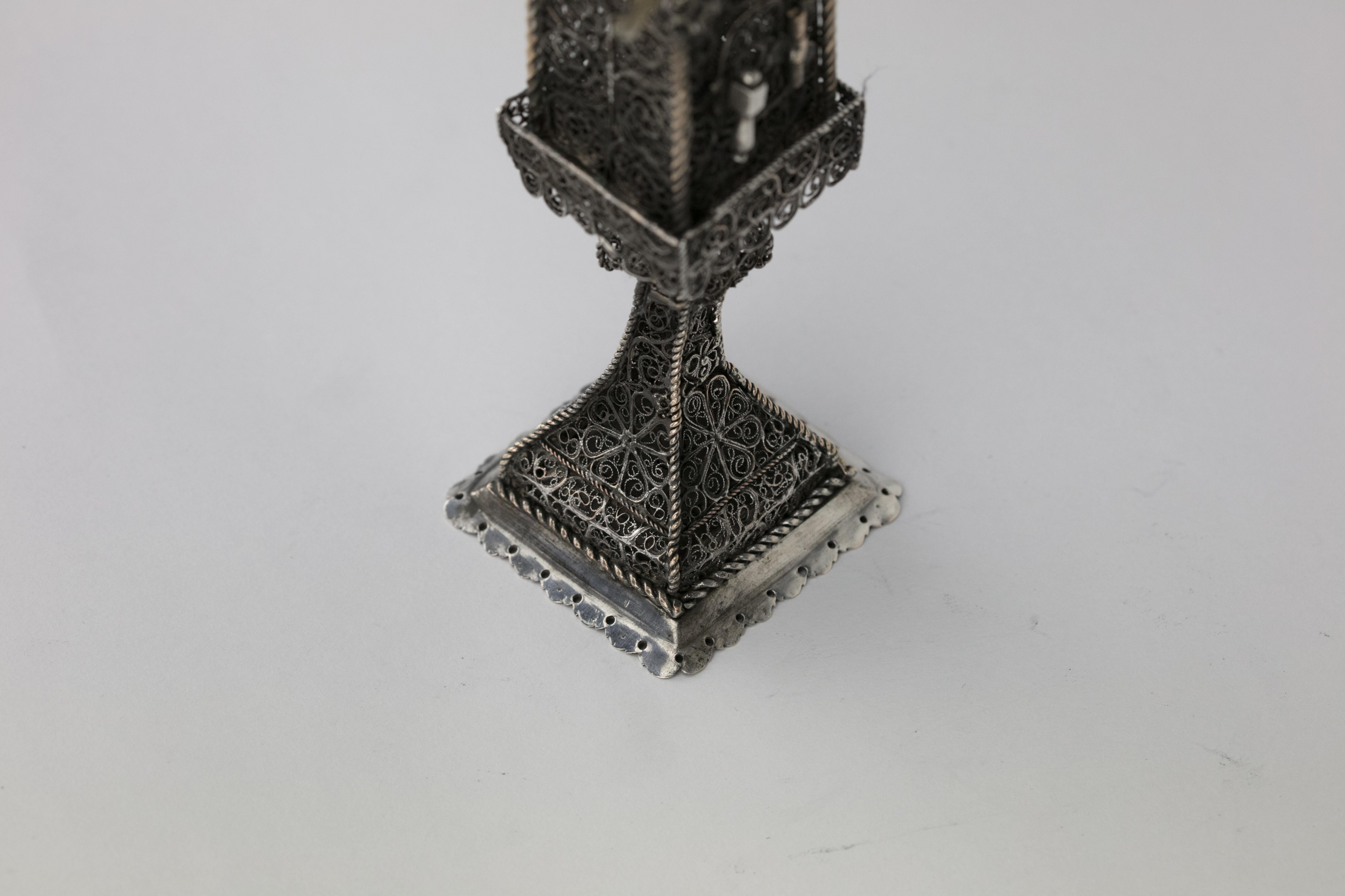 Handmade silver and silver filigree spice tower, Ukraine, Lemberg (Lvov), circa 1780.
On solid square base. Made entirely of hand spun filigree. With four small flags decorating main section.
The main section (the box) has a hinged filigree door