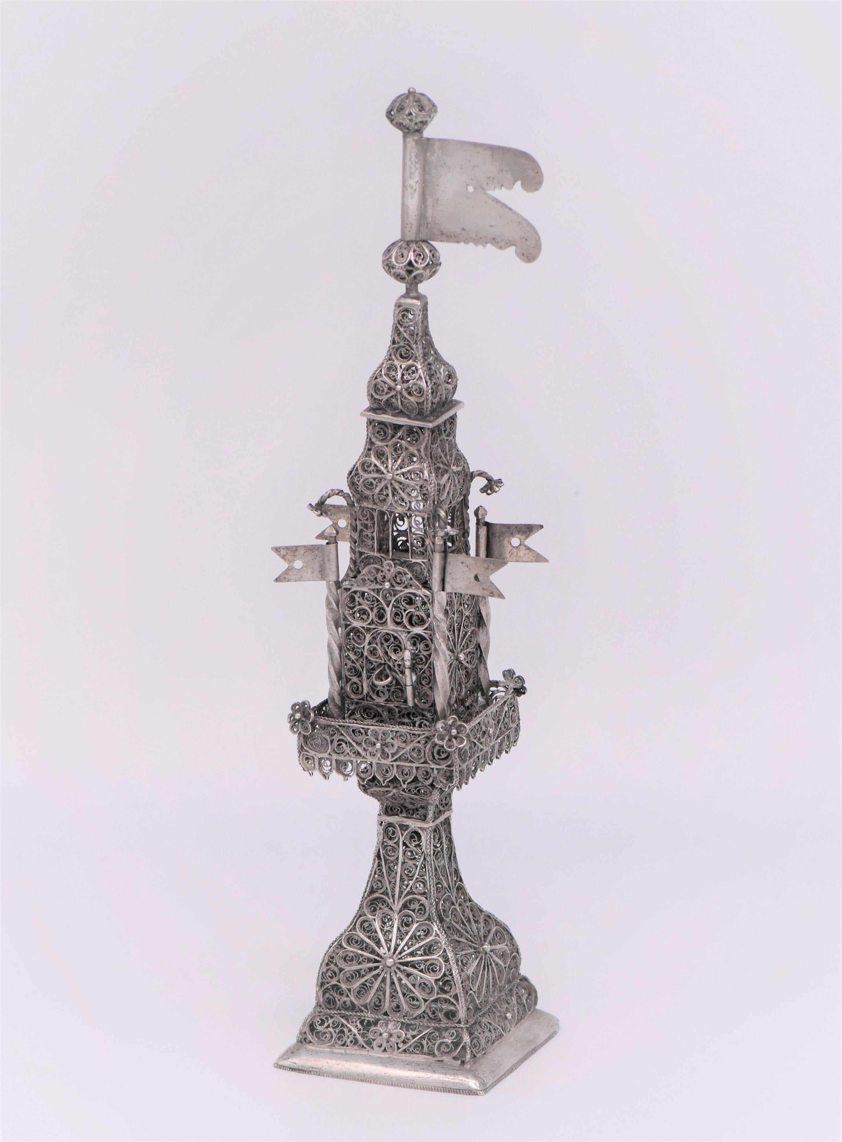 Handmade silver and silver filigree spice tower, Ukraine, Lemberg (Lvov), circa 1780.
On solid square base. Made entirely of hand spun filigree. With four small flags decorating main section.
The main section (the box) has a hinged filigree door