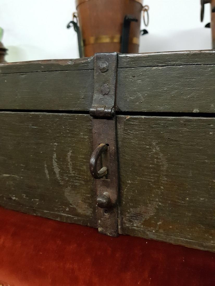 Antique wooden value transport box with 3 eyes for padlocks and further provided with wrought iron bands and handles, this is in a good condition with some wear traces around the age. This is from the end of the 18th century.

The measurements