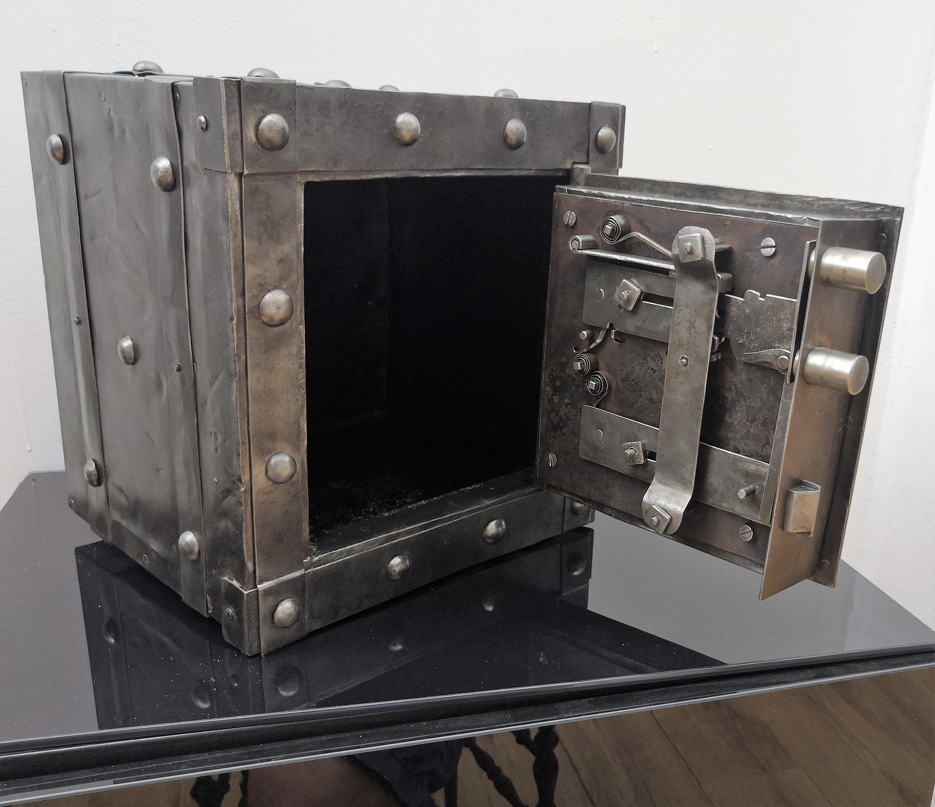Northern Italian antique safe with all-around hobnails, dated circa 1790-1820, probably from the Piedmont region with great metal patina and beautiful burin incisions, a typical handmade technique of 'dots' engraving process typical from the period.