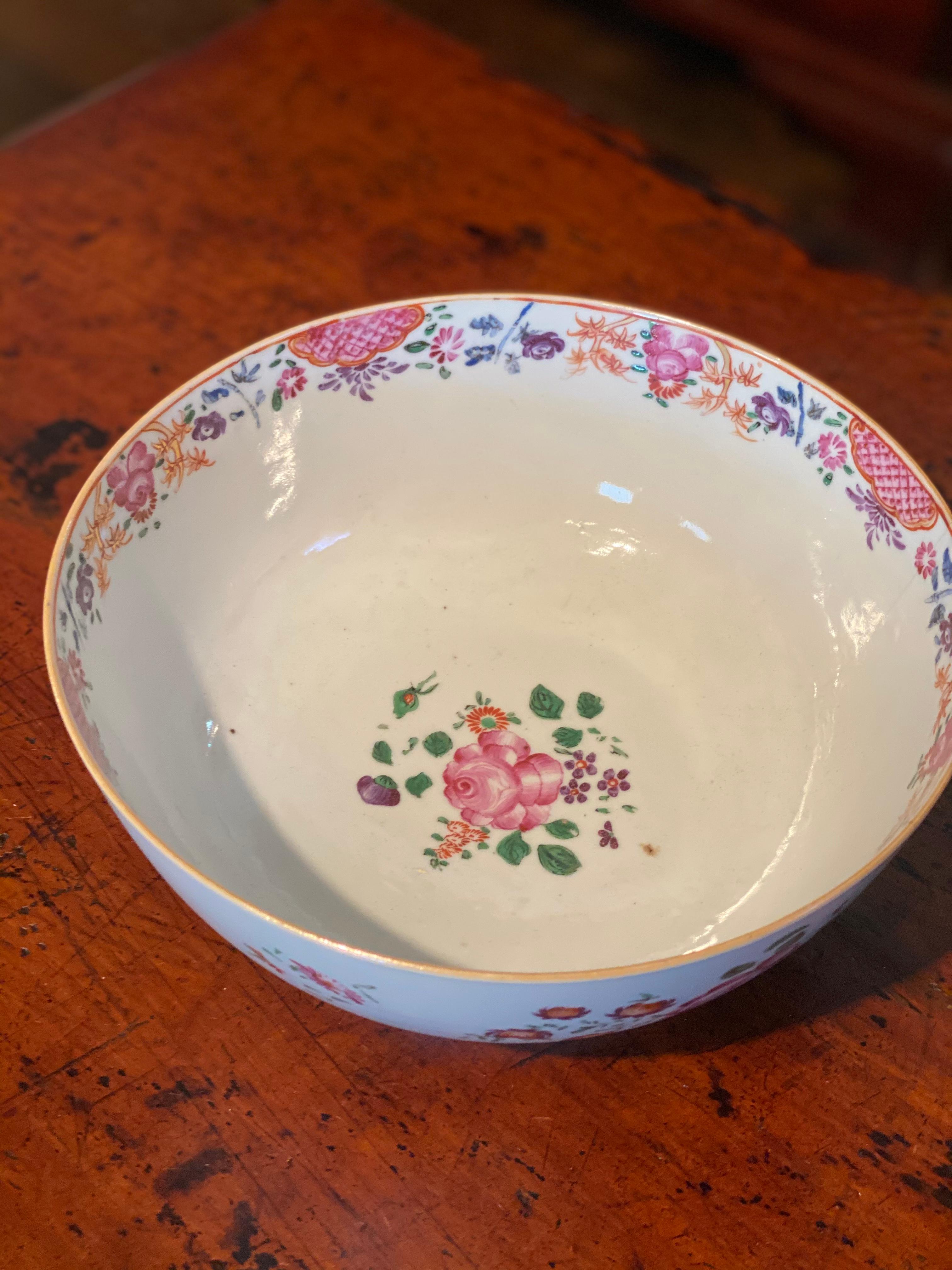 Late 18th- early 19th century Chinese export punch bowl with flowers. One hairline crack seen, but structurally sound and great condition otherwise.