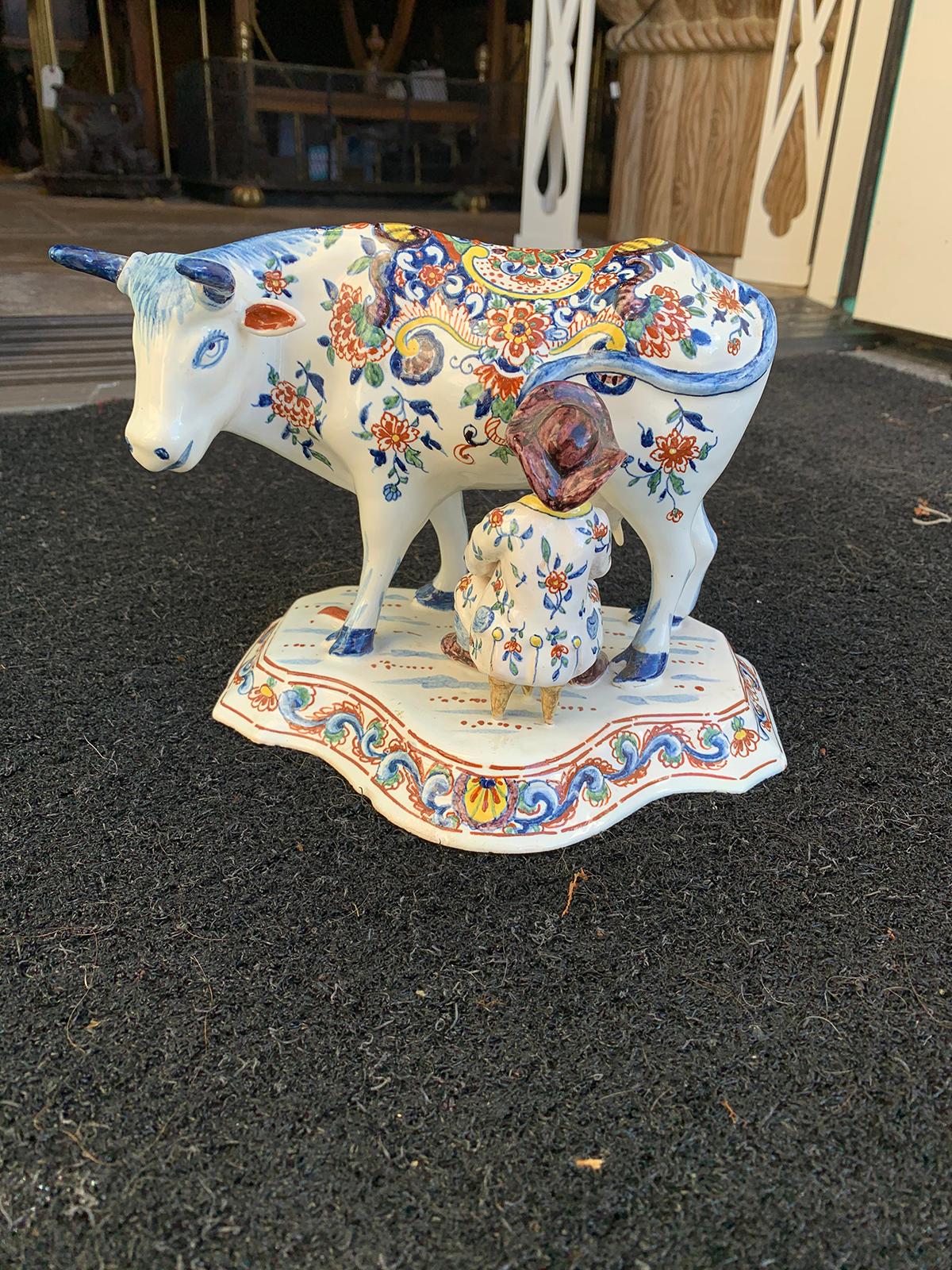 Late 18th-early 19th century Dutch delft polychrome porcelain figural cow milking group
Base measures: 8