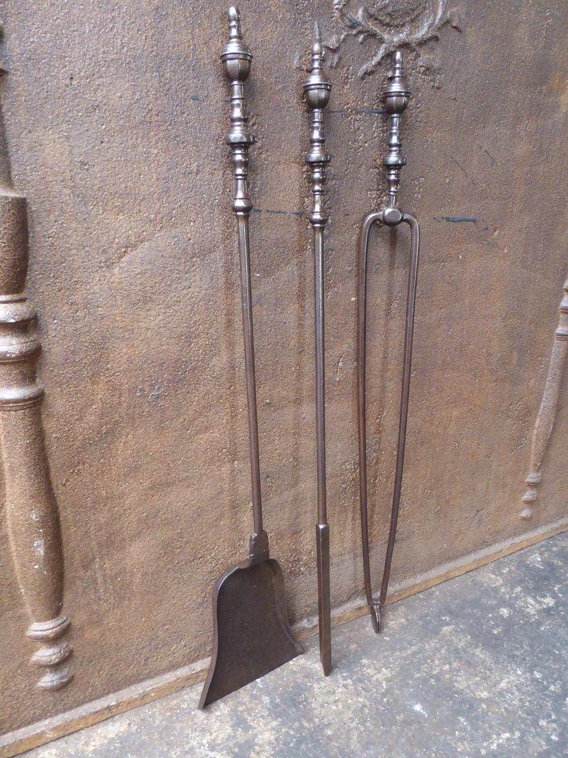Late 18th or early 19th century Dutch neoclassical fireplace tool set. It is made of wrought iron. The tool set is in a good condition and is fully functional.








 