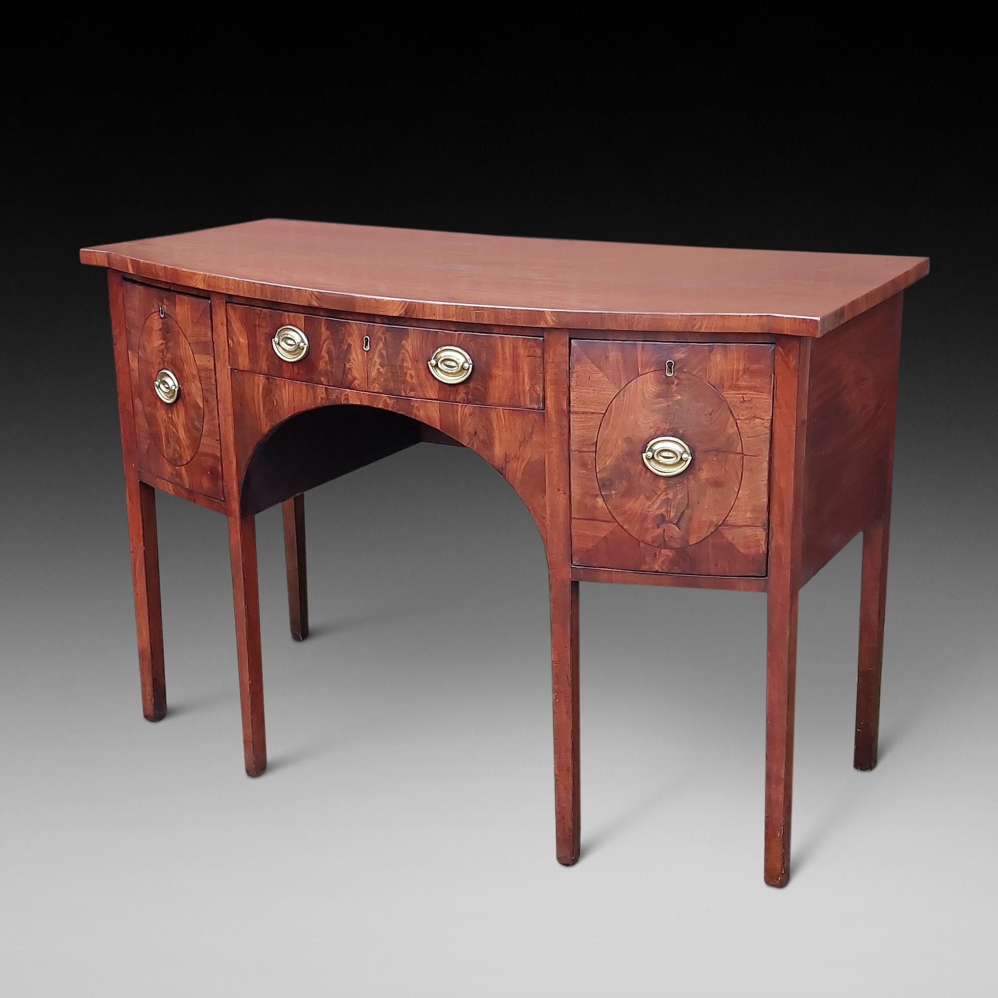 Late 18thC Georgian Mahogany Sideboard of Bow Formed on Sheraton Square Tapered Legs and original brass fittings with cellarette and fitted cuttlery drawers - 54£ x 27