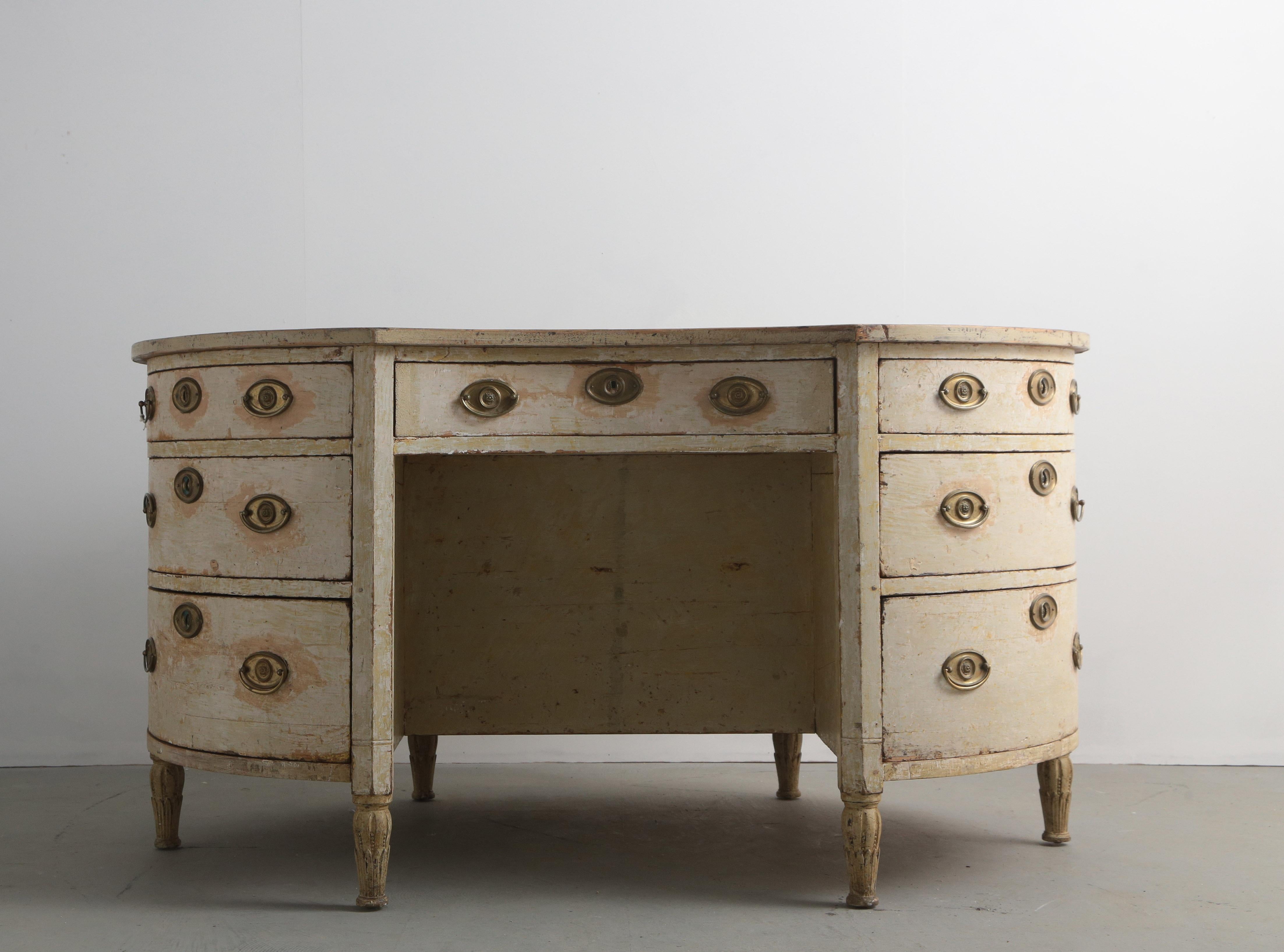 An early 19th century Swedish curved desk with drawers front and back. Original paintwork with a Shagreen covered top.
