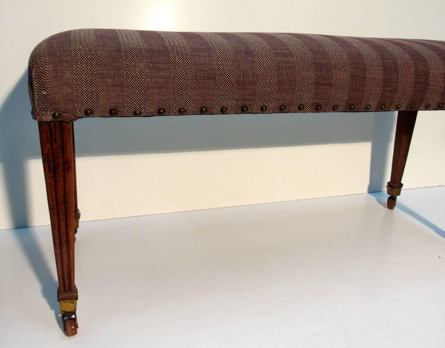 Late 18th-early 19th century Italian bench frame with a later purple stripe fabric, from a Peter Marino project.