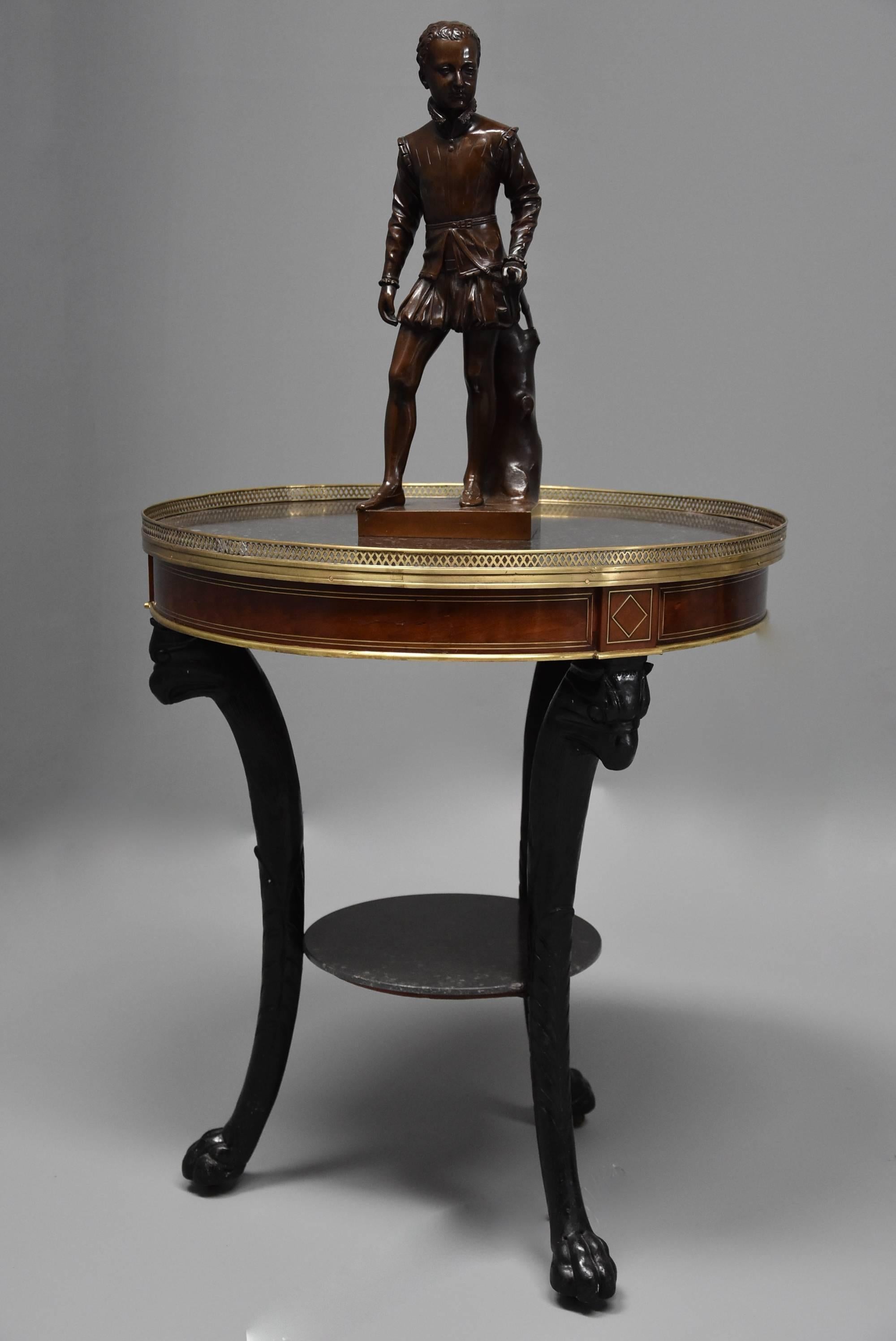 A highly decorative late 18th-early 19th century French Empire mahogany and marble gueridon table.

This table consists of an original St Anne marble top in grey/black tones in very good condition, the marble surrounded by a pierced lattice brass