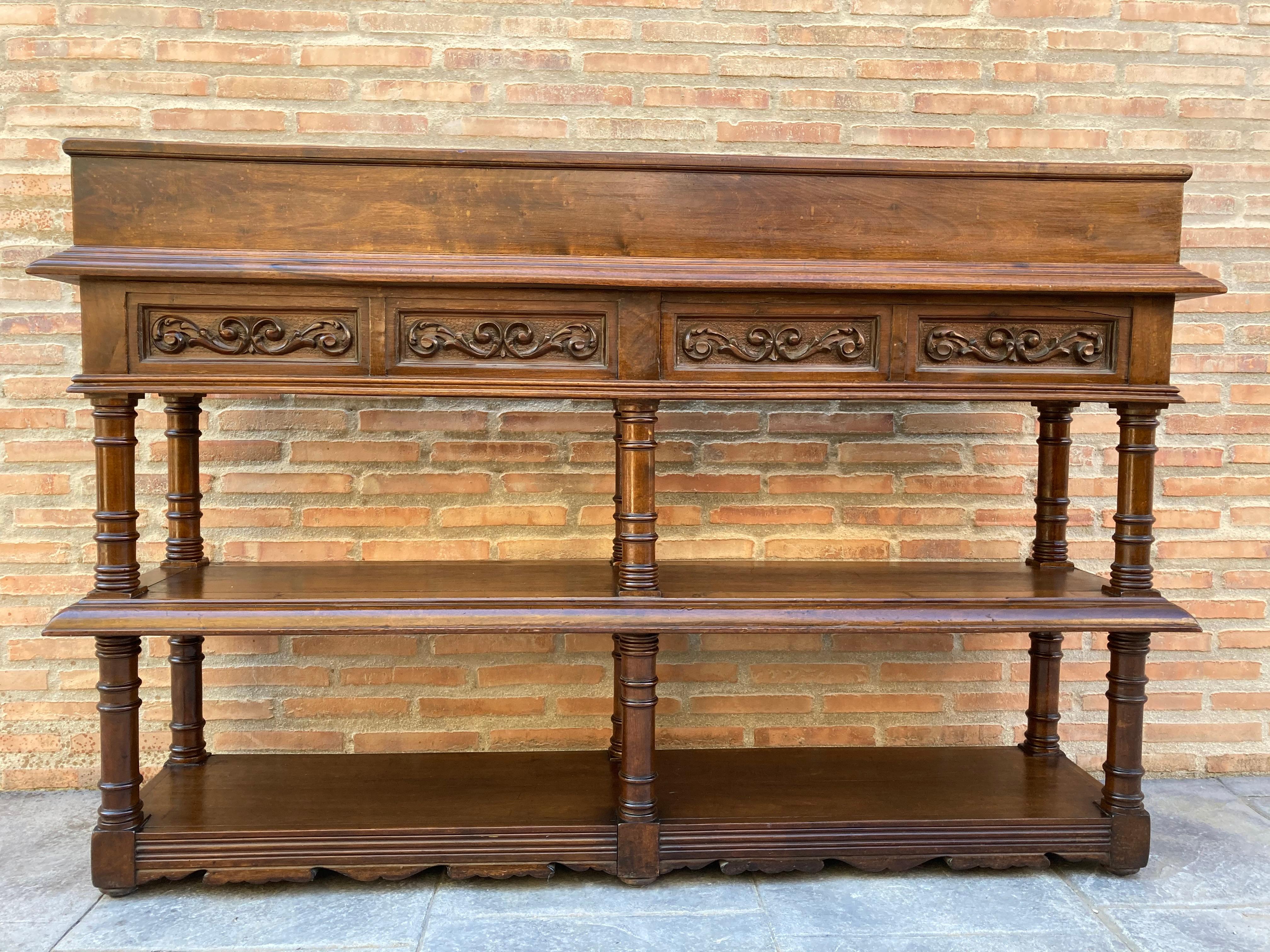 Antique French Renaissance server sideboard carved from oak

Magnificent French Renaissance style server sideboard carved from oak. 
Outstanding carvings on all sides, both on the front of the four drawers with their iron handles, and on the