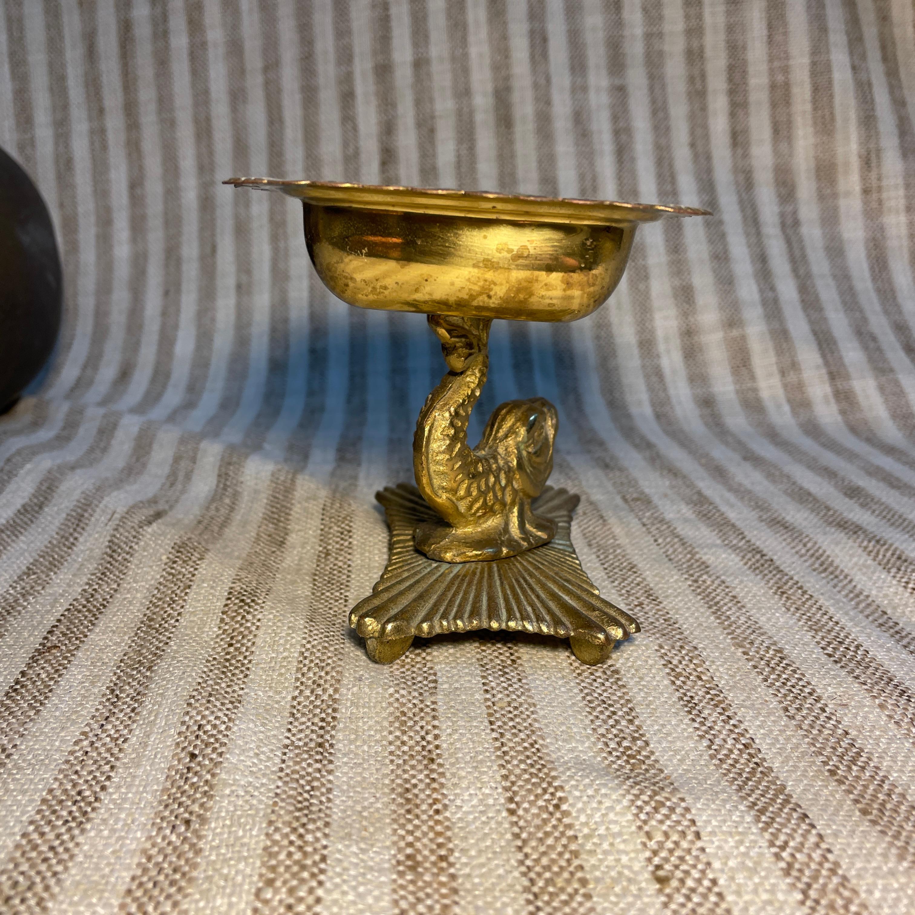 Brass and brass plated soap dish circa late 1930s early 1940s. There is some wear to the inside of the soap dish. The rest of the item is in good condition for its age. The base of this item that the koi fish is perched upon is the neatest! I love