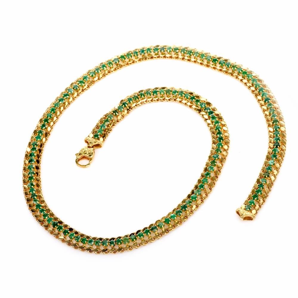 This alluringly delicate, classically elegant yellow gold and emerald vintage necklace is designed and manufactured by Murat Jewelers  and bears their signature and the purity mark '750'.  The necklace weighs 29.2 grams and measures 19 inches long