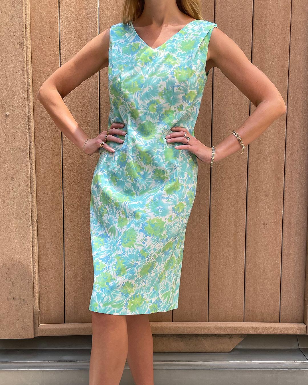 labor required. Look at the draping from the shoulders, as well as the seams in the back, which give shape without taking away from that easy shift silhouette. The fabric is really lightweight and airy, making this the perfect summer dress. Closes