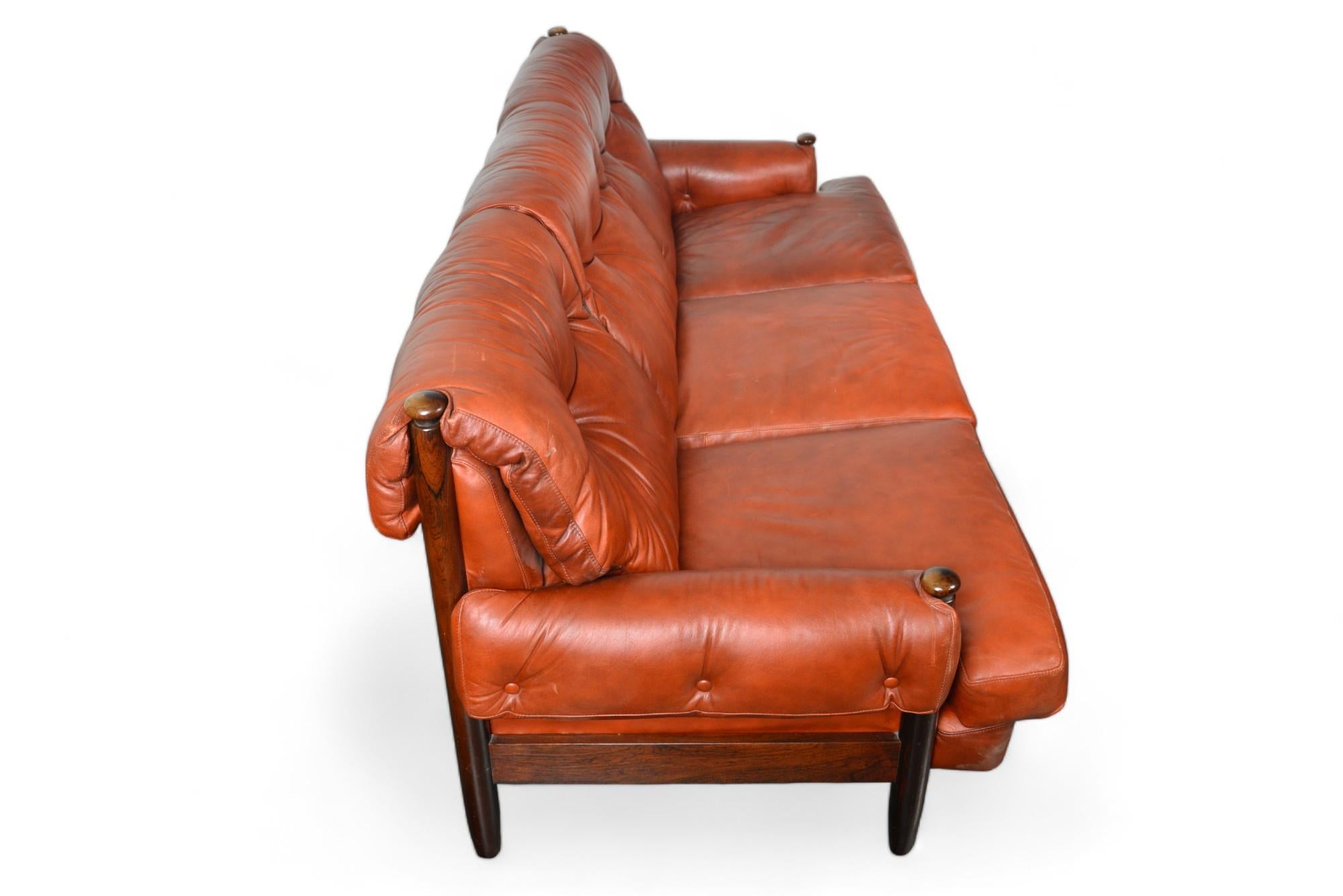 20th Century Late 1960s Danish Solid Rosewood + Rust Leather Three Seat Sofa