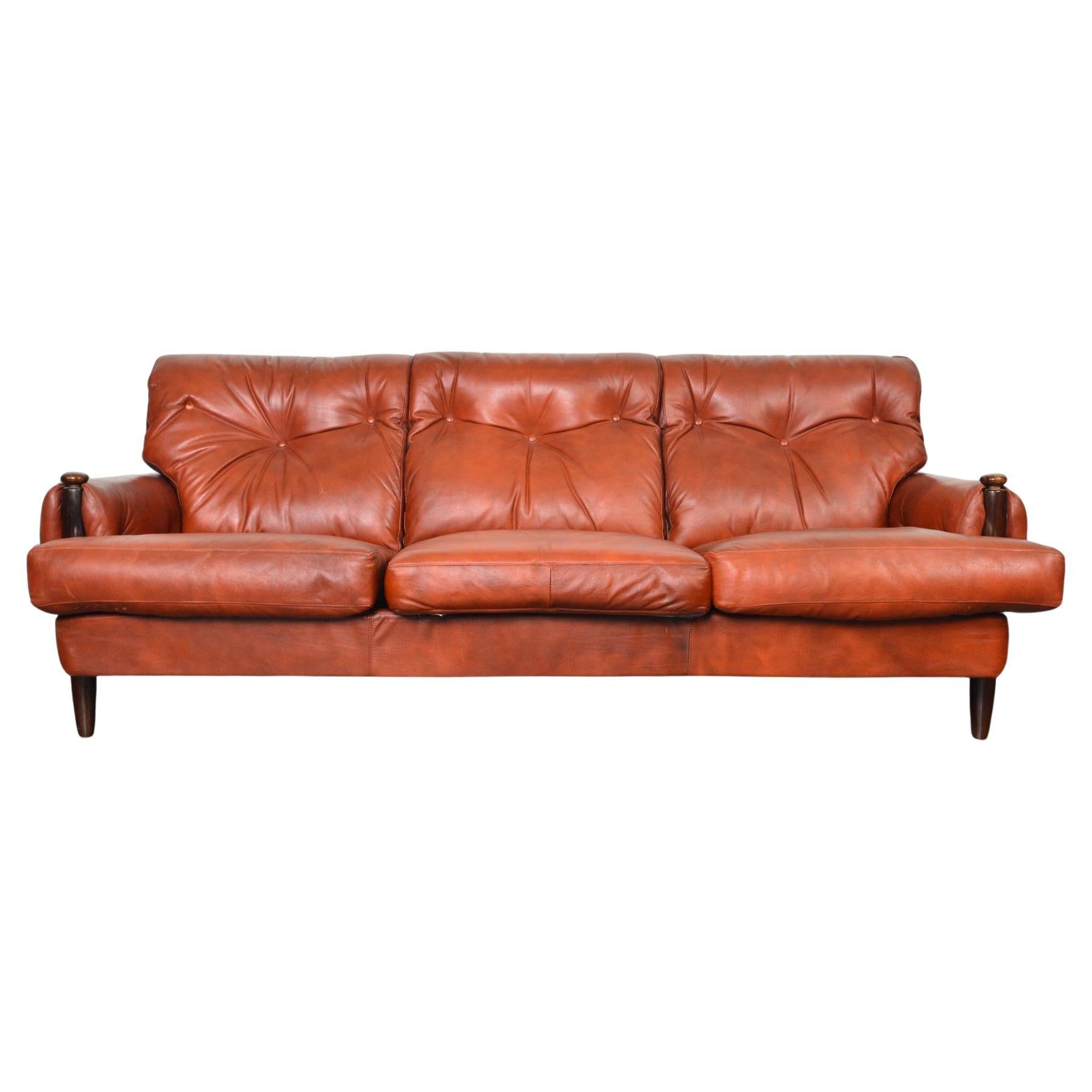 Late 1960s Danish Solid Rosewood + Rust Leather Three Seat Sofa For Sale