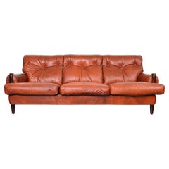 Late 1960s Danish Solid Rosewood + Rust Leather Three Seat Sofa