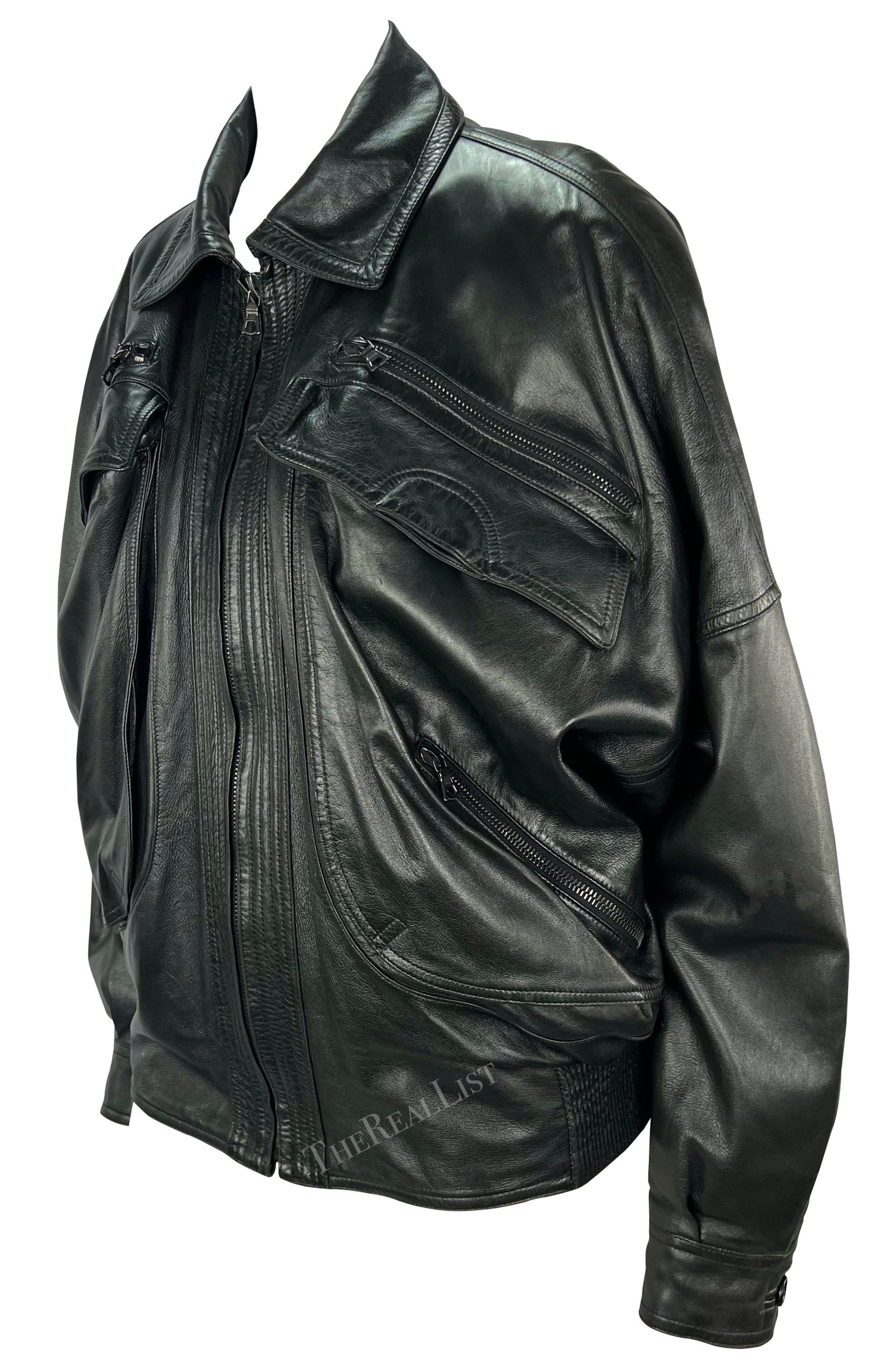 Presenting a fabulous black leather Gianni Versace oversized jacket, designed by Gianni Versace. From the late 1980s, this menswear jacket is constructed entirely of leather and features a fold-over collar and a plethora of pockets at the front. In