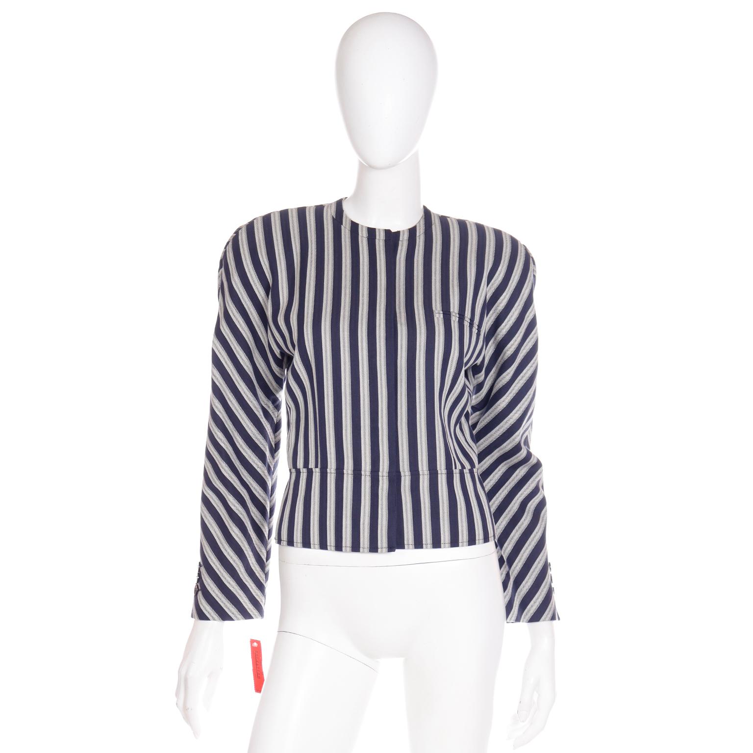 This vintage late 1980's Giorgio Armani navy blue and white striped cotton jacket is so easy to wear and it will instantly elevate a simple pair of pants, a skirt or even a simple dress. This great Armani jacket is deadstock, with its original tag