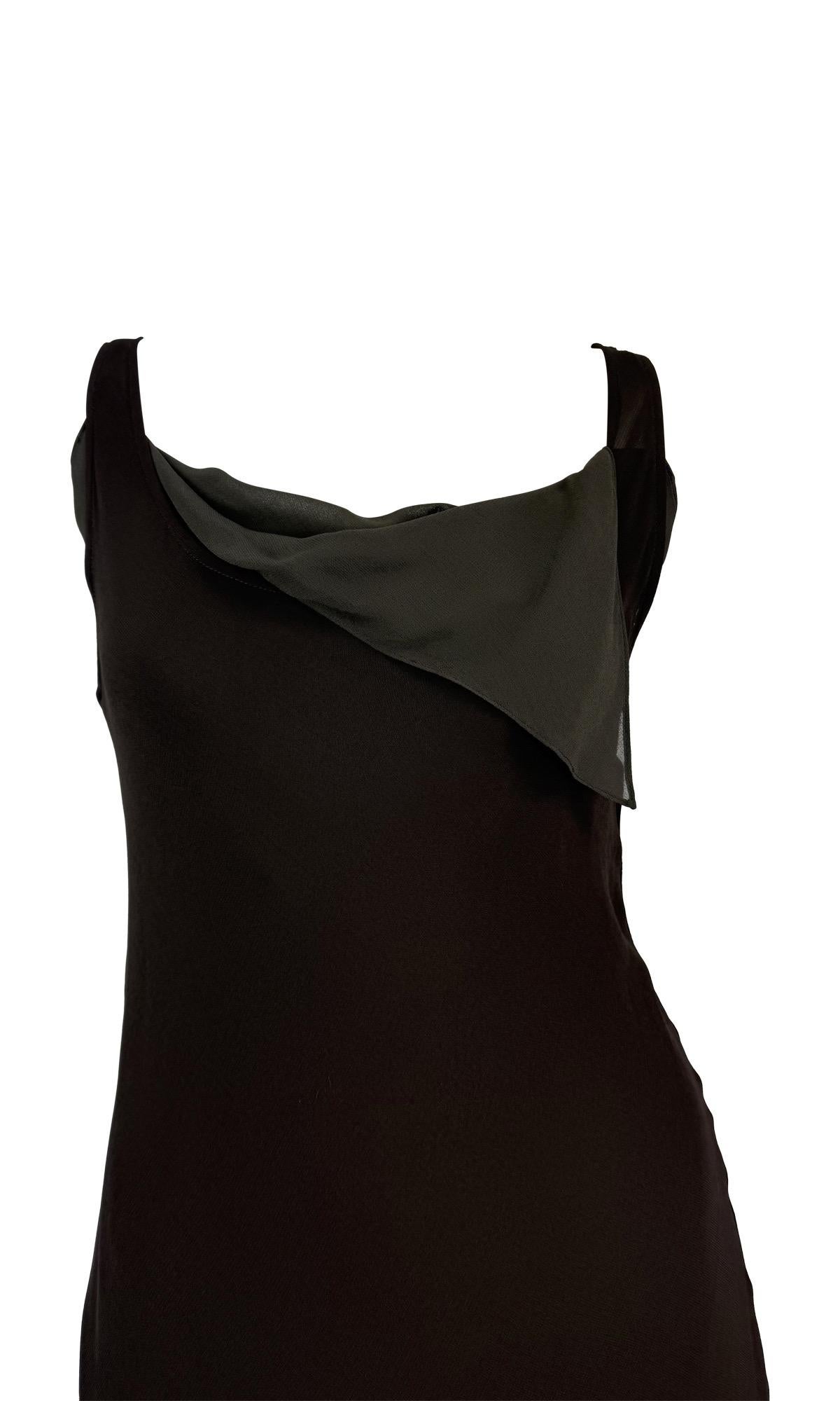 This late 1990s Donna Karan dress features a sheer dark brown slip with an asymmetric grey underlay. The design includes a draped neckline, a fitted silhouette, and an uneven hemline, creating a layered, flowing effect.

Approximate