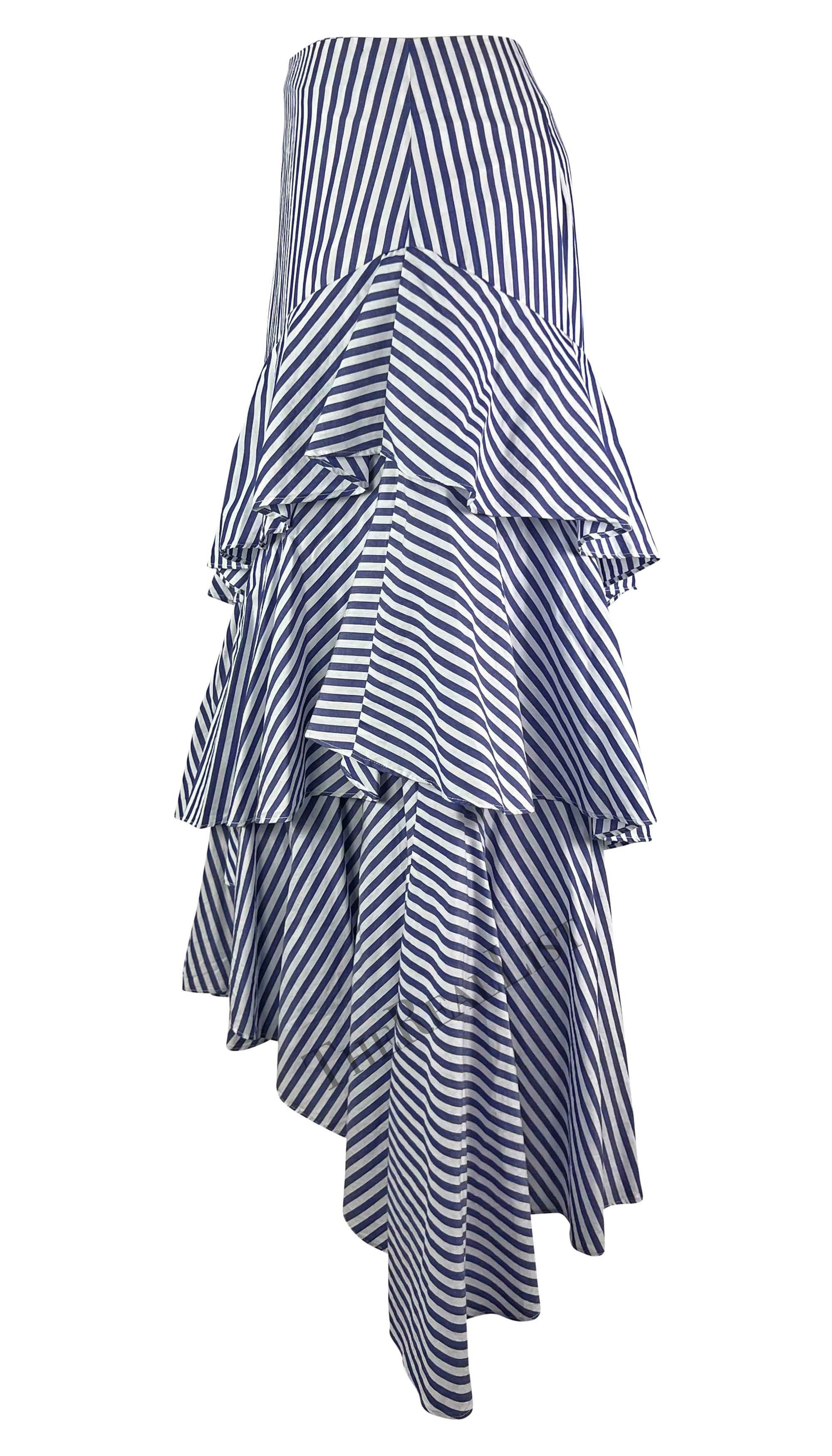 Presenting a fabulous blue and white stripe Giorgio Armani maxi skirt. From the late 1990s, this striped skirt features layers of asymmetric ruffles. Whether paired with a classic white collared shirt or crop top, this effortless, timeless, and chic