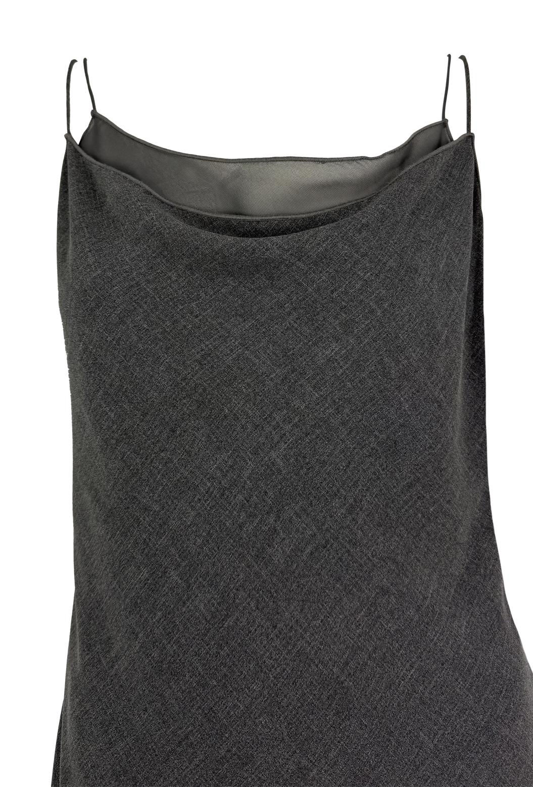 This late 1990s Giorgio Armani grey chiffon double slip dress is a stunning example of the designer's minimalist designs. Featuring spaghetti straps, a draped neckline, and a layered slip construction, the dress offers subtle texture and movement.