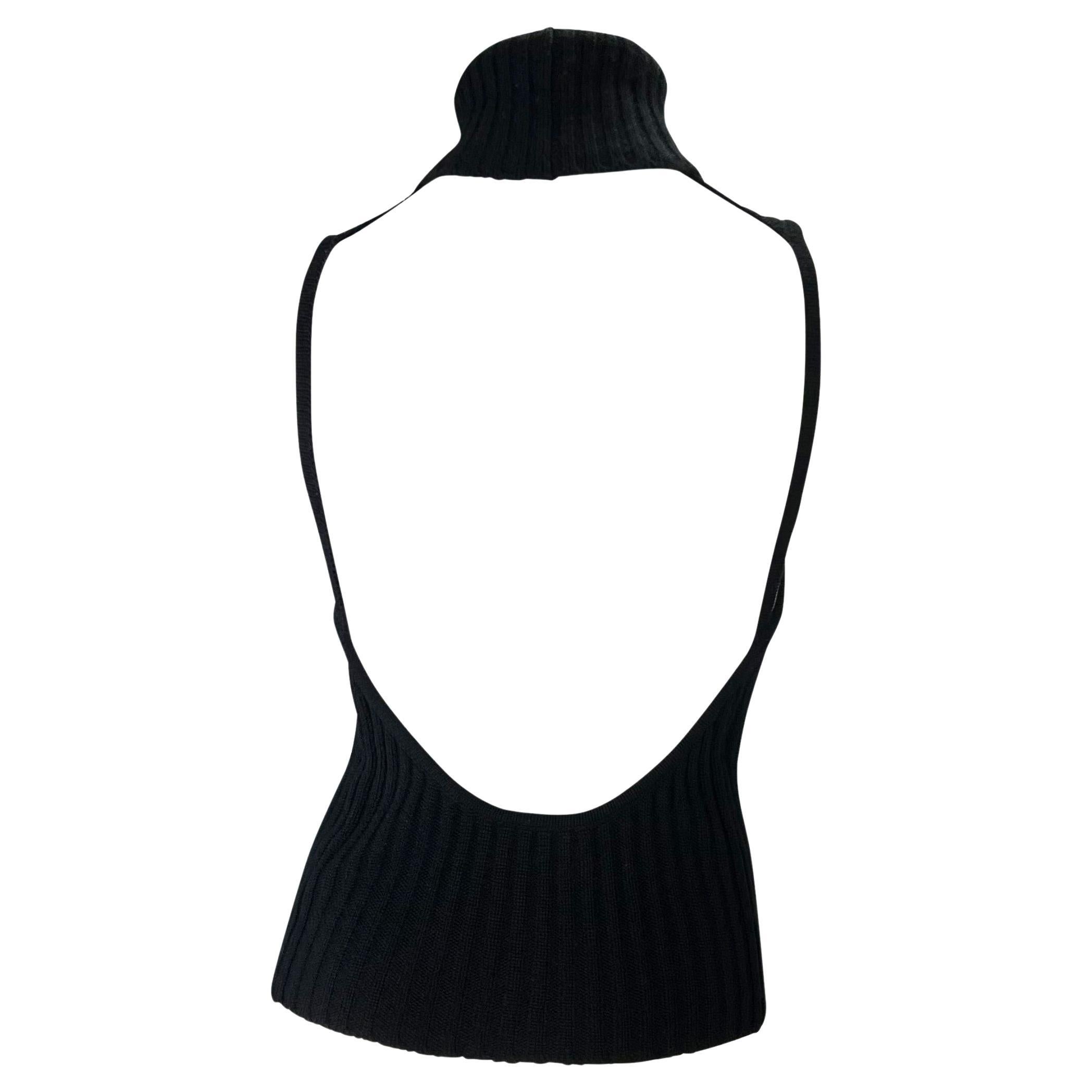 TheRealList presents: an incredible backless cashmere Gucci turtleneck top, designed by Tom Ford. From the late 1990s, this sensual top is constructed entirely of black cashmere. Not your average turtleneck sweater, this ultra-sexy sleeveless and