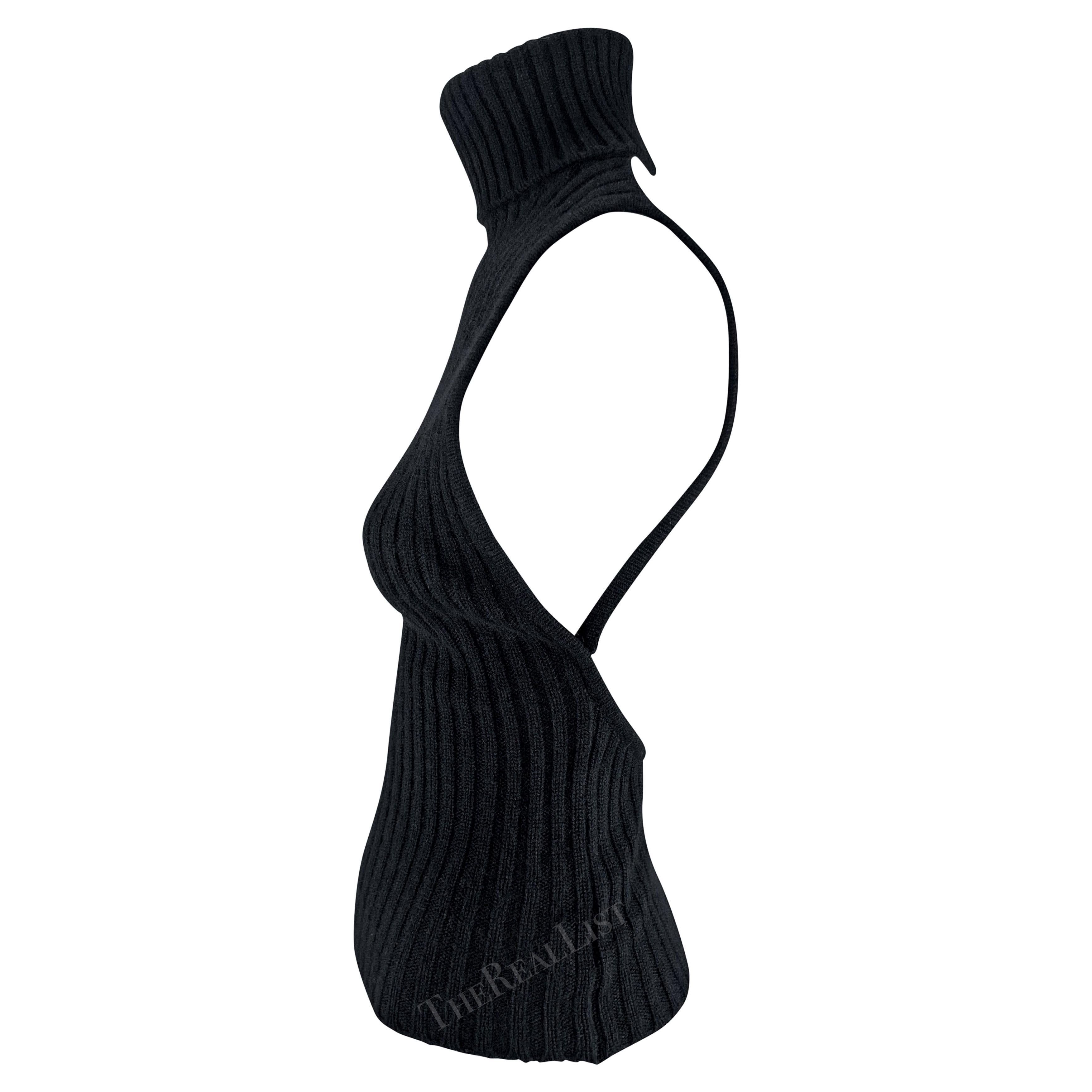 TheRealList presents: an incredible backless cashmere Gucci turtleneck top, designed by Tom Ford. From the late 1990s, this sensual top is constructed entirely of black cashmere. Not your average turtleneck sweater, this ultra-sexy sleeveless and