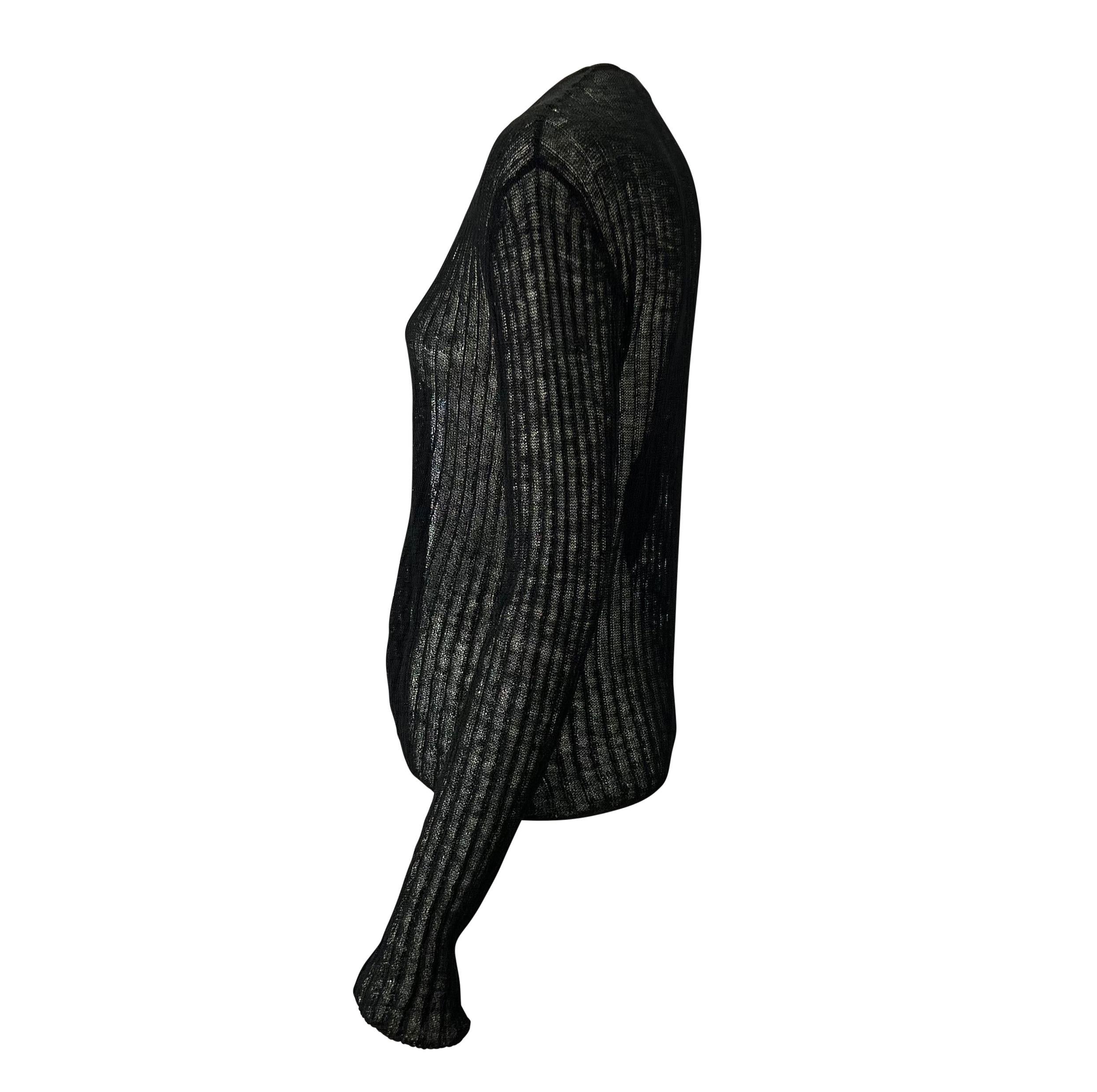 TheRealList presents: a sheer knit cardigan top designed by Tom Ford for Gucci in the late 1990s. The stretchy fabric is held together at the bust with a branded metal Gucci clasp, allowing for an open waist. Add this slinky Tom Ford version of the