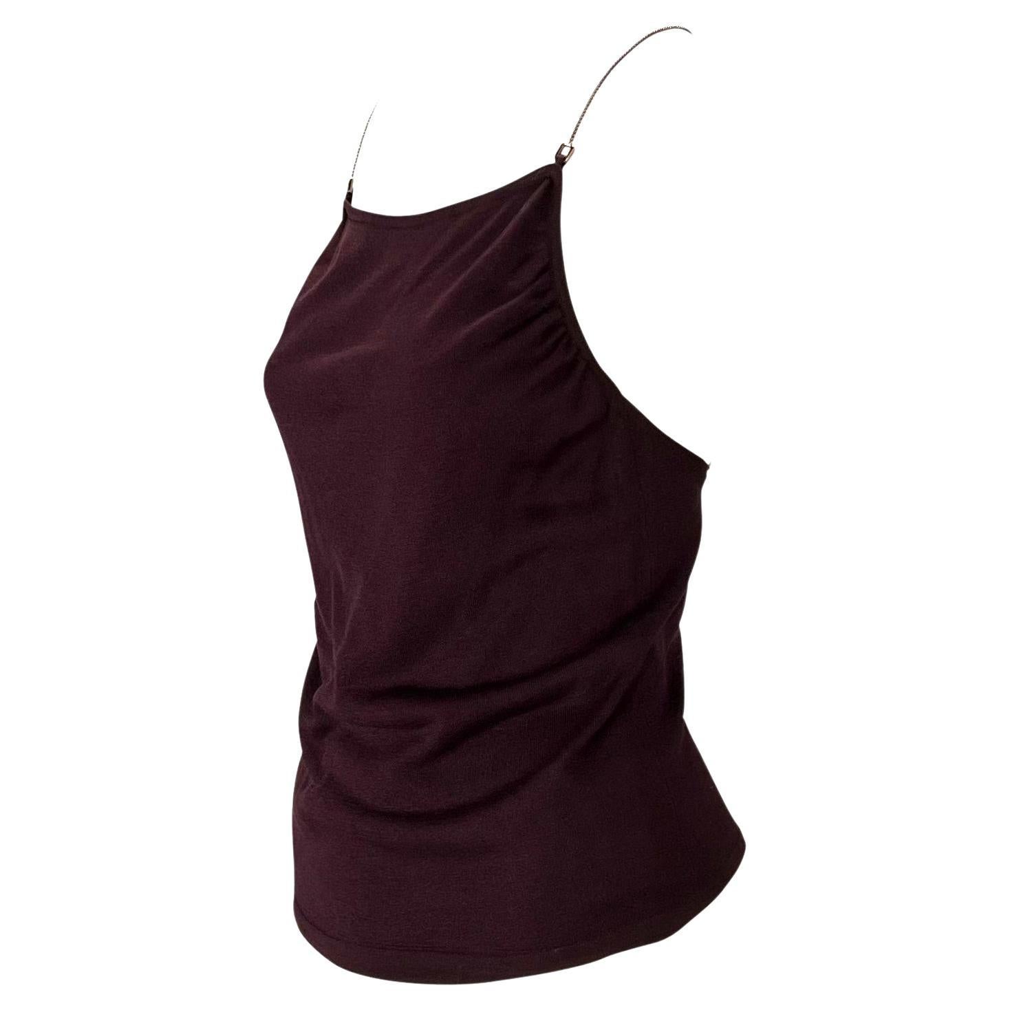 Presenting a burgundy silk Gucci tank top, designed by Tom Ford. From the late 1990s, this top is constructed entirely of silk and features a square neckline and semi-exposed back. This incredible top is made complete with tonal chain straps with