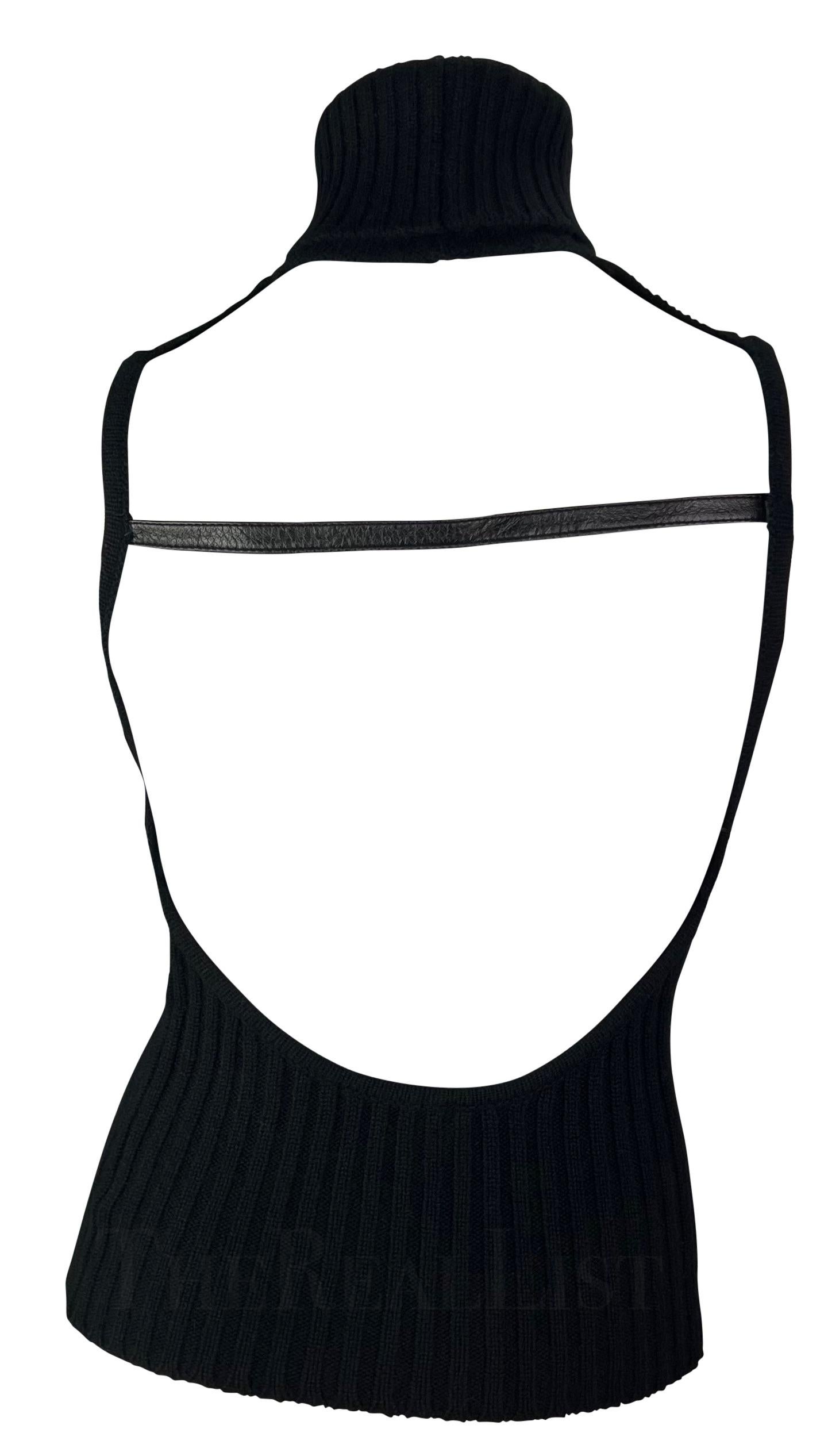 Presenting an incredible backless cashmere Gucci turtleneck top, designed by Tom Ford. From the late 1990s, this sensual top is constructed entirely of black cashmere. Not your average turtleneck sweater, this ultra-sexy sleeveless and backless top